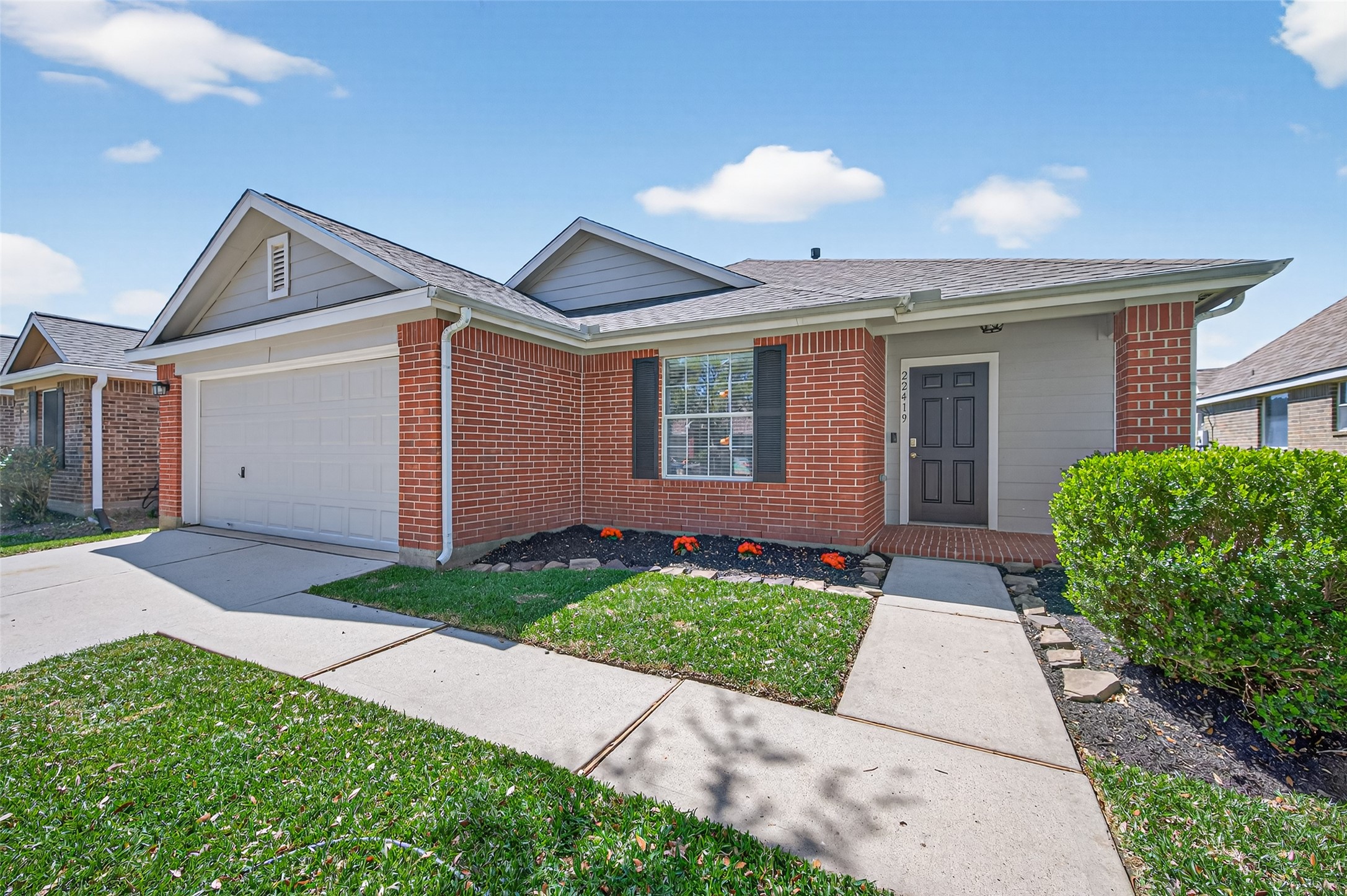 22419 Bridgestone Ridge Drive Spring, TX 77389 - Photo 2 of 48 a front view of a house with a yard