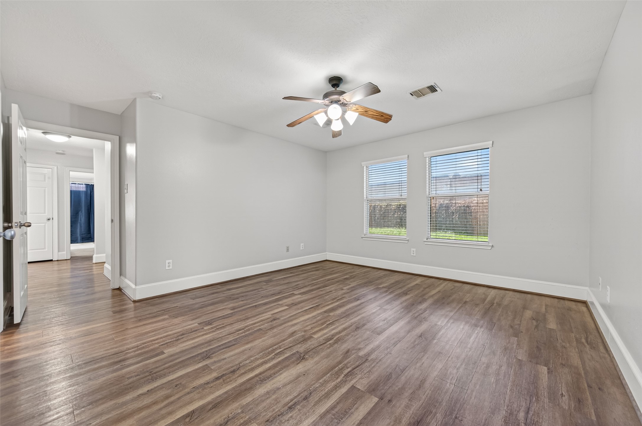 22419 Bridgestone Ridge Drive Spring, TX 77389 - Photo 21 of 48 a view of empty room with wooden floor and fan