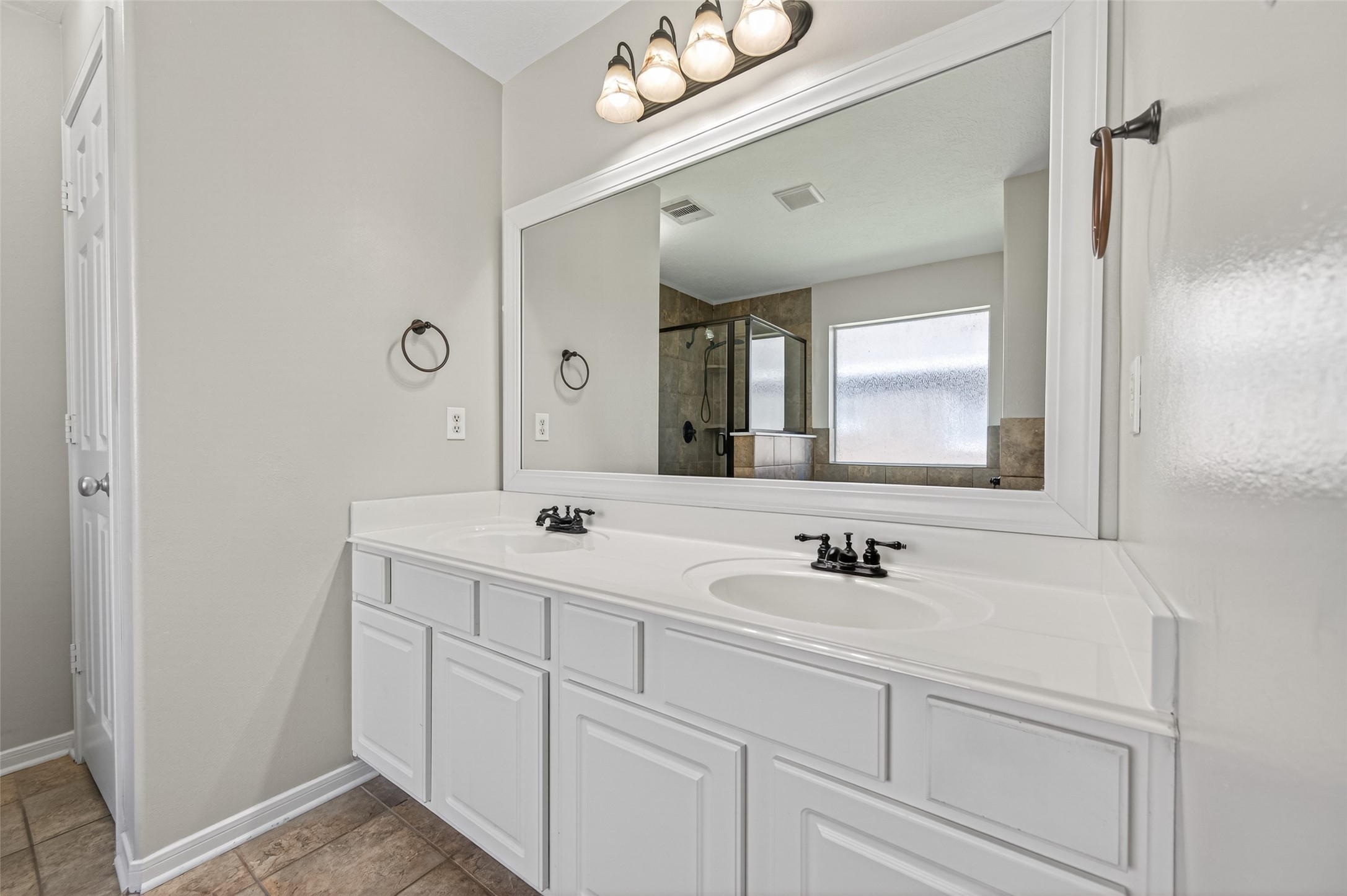 22419 Bridgestone Ridge Drive Spring, TX 77389 - Photo 25 of 48 a bathroom with a double vanity sink mirror and