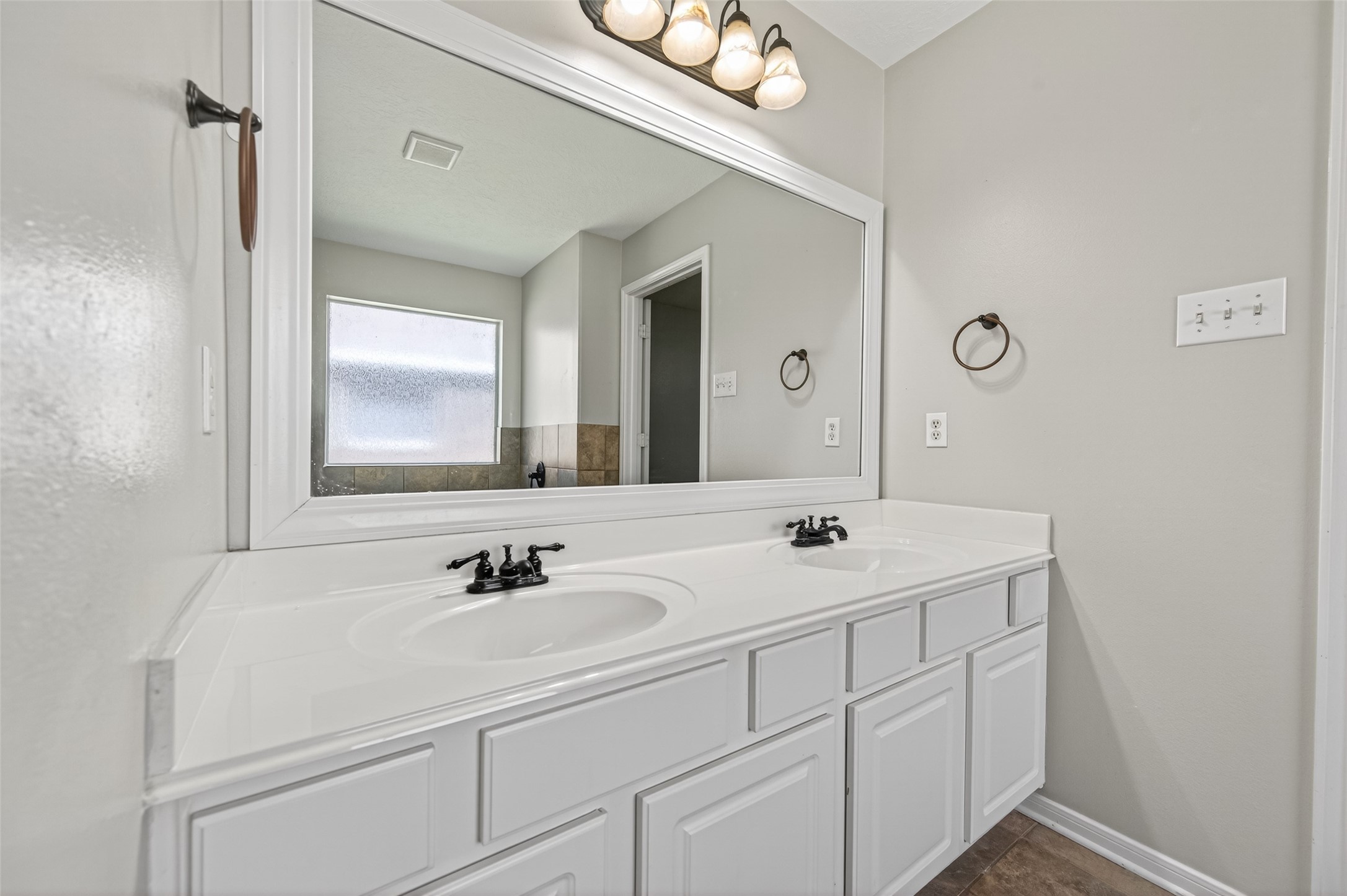 22419 Bridgestone Ridge Drive Spring, TX 77389 - Photo 26 of 48 a bathroom with a sink and a mirror