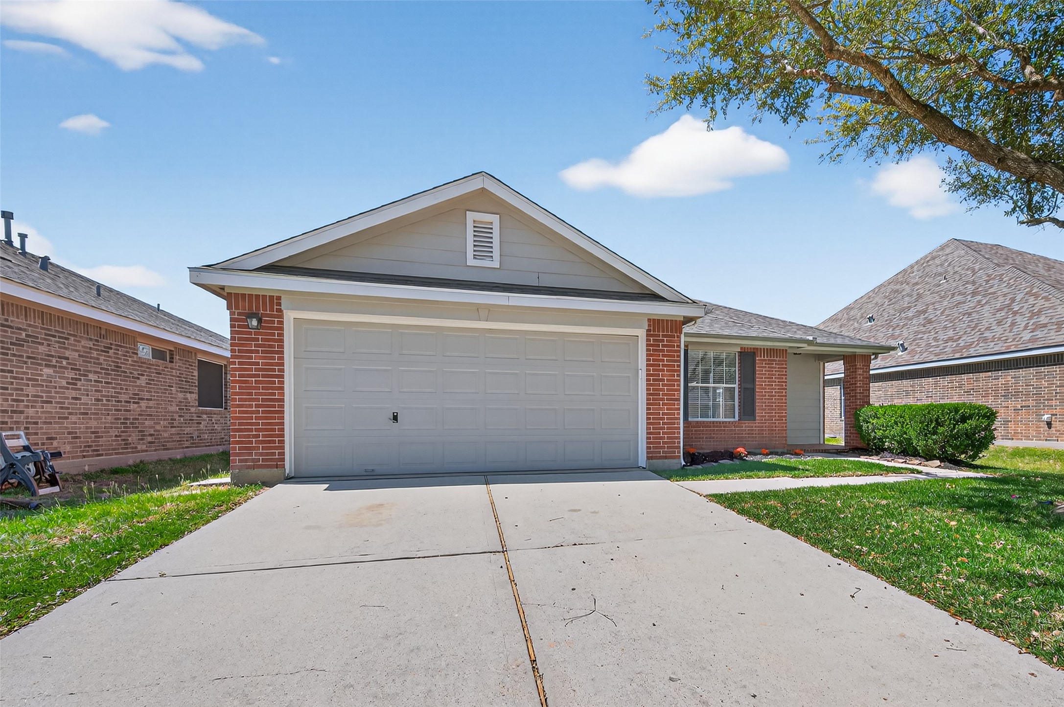 22419 Bridgestone Ridge Drive Spring, TX 77389 - Photo 47 of 48 a front view of a house with a yard and garage