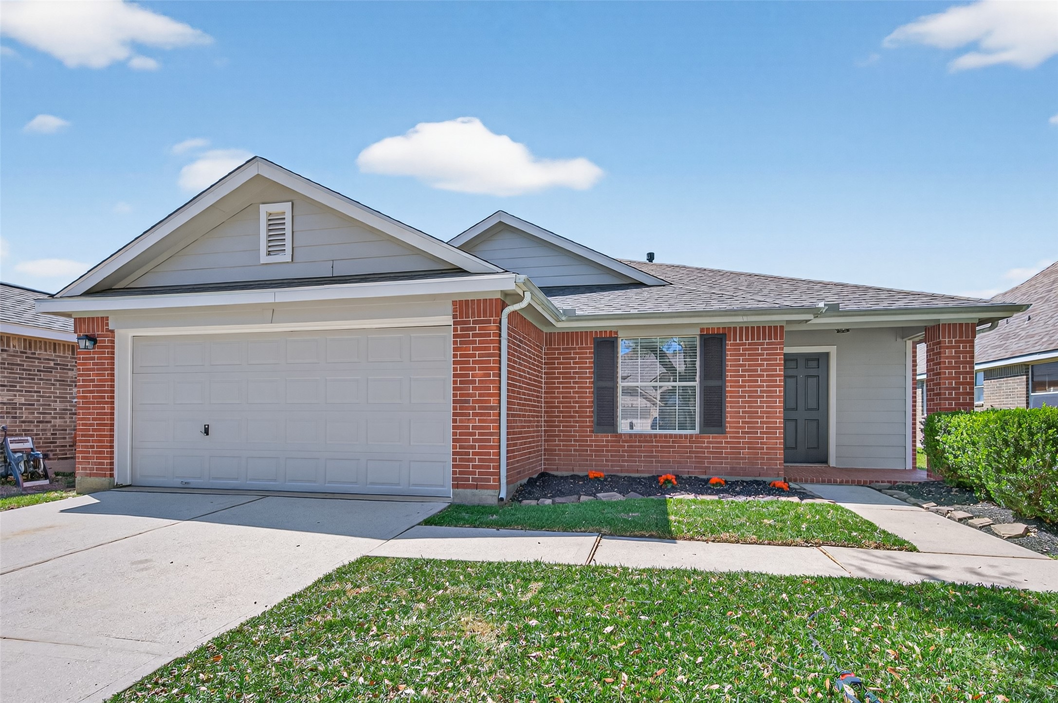22419 Bridgestone Ridge Drive Spring, TX 77389 - Photo 48 of 48 a front view of a house with a yard and garage
