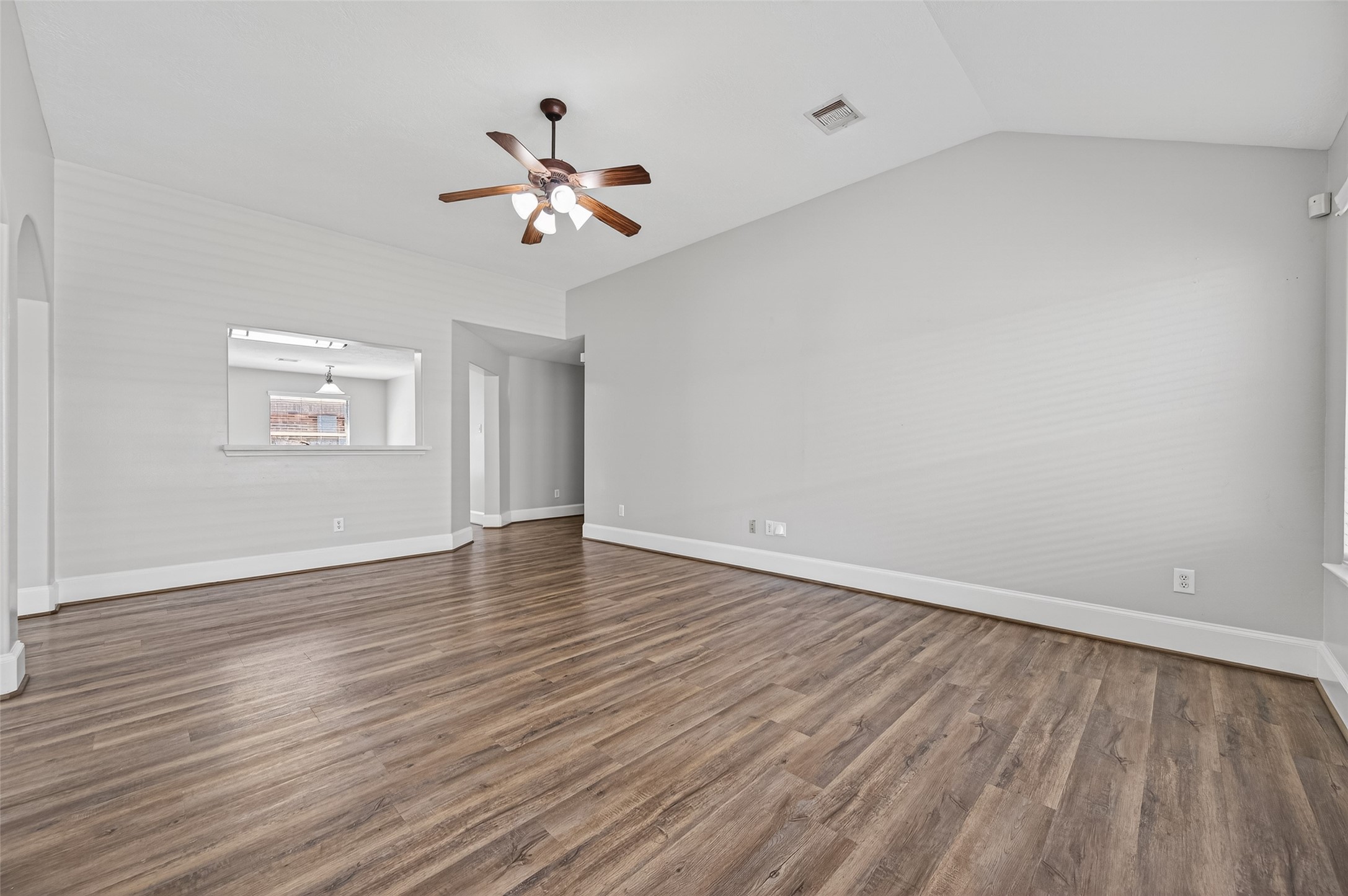 22419 Bridgestone Ridge Drive Spring, TX 77389 - Photo 9 of 48 a view of an empty room with wooden floor and a window