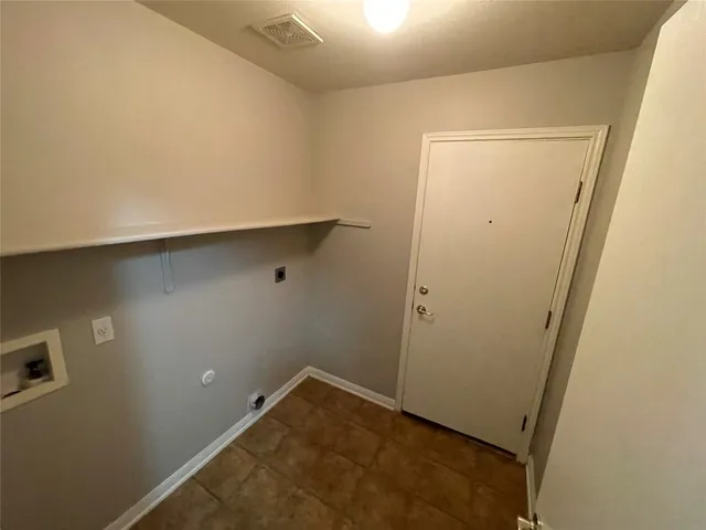 an empty room with wooden floor