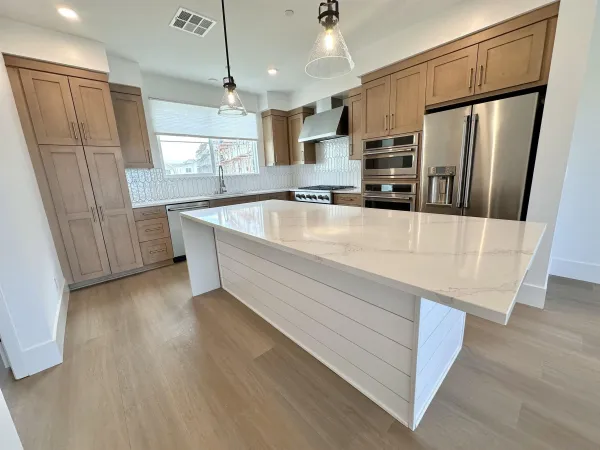 a kitchen with refrigerator and window