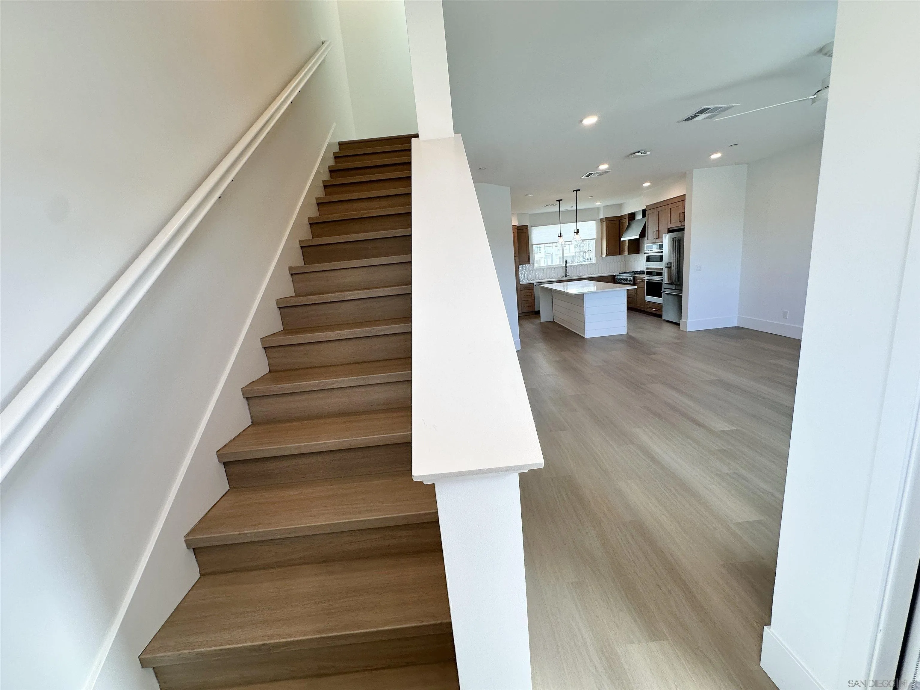 7290 Ponto Drive West, Unit 7132 Carlsbad, CA 92011 - Photo 23 of 44 a view of entryway and kitchen