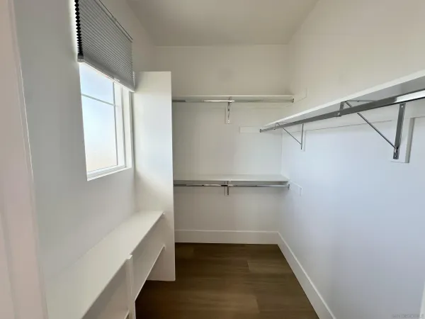 a bathroom with a granite countertop sink mirror and double