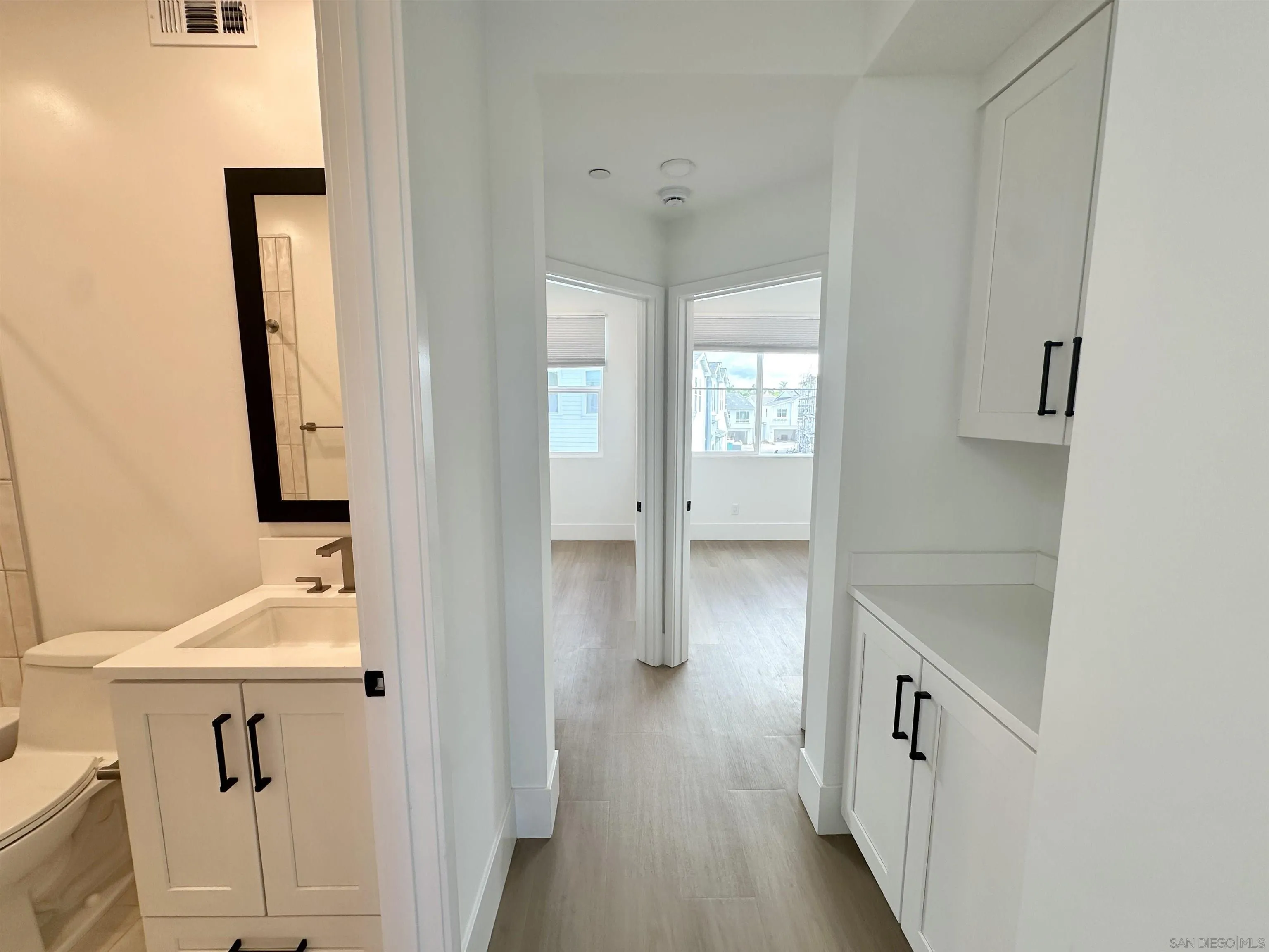 7290 Ponto Drive West, Unit 7132 Carlsbad, CA 92011 - Photo 30 of 44 a bathroom with a sink and a mirror
