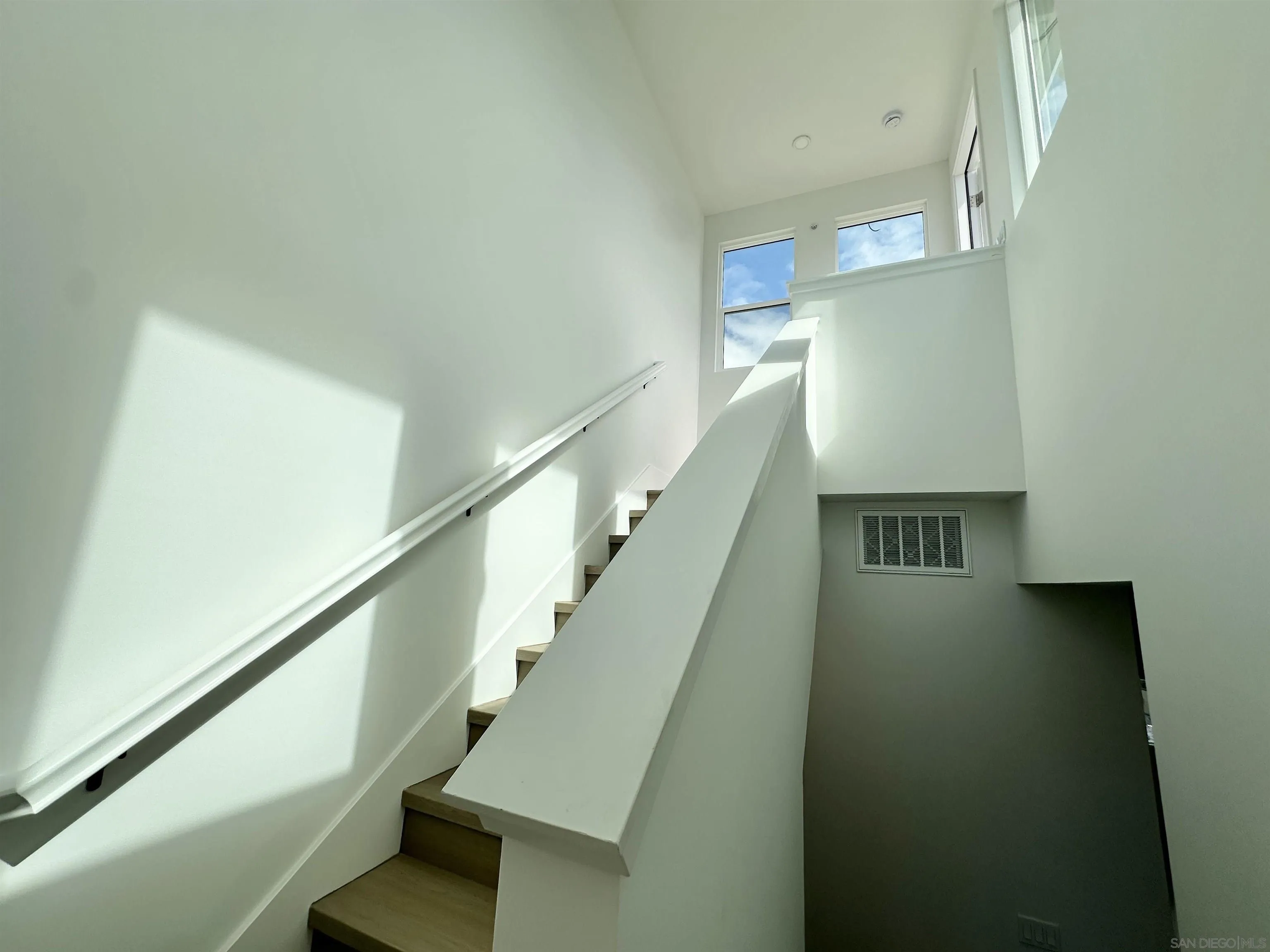 7290 Ponto Drive West, Unit 7132 Carlsbad, CA 92011 - Photo 36 of 44 a view of entryway and hall with wooden floor