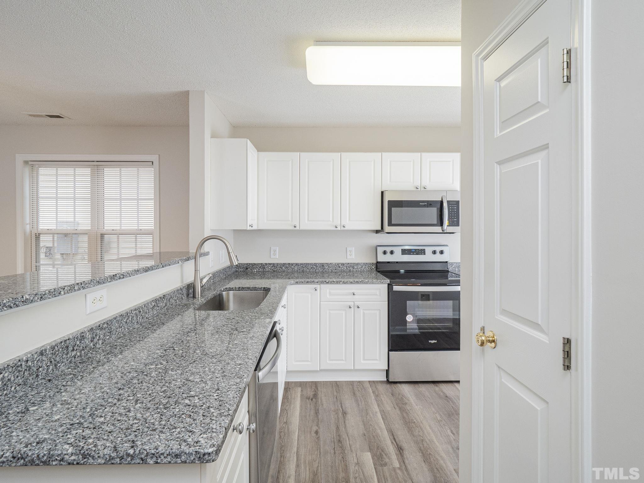 2317 Turtle Point Drive Raleigh, NC 27604 - Photo 5 of 28 New granite countertops and stainless steel sink!