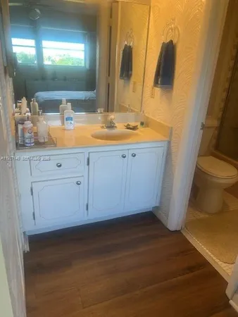 a bathroom with a shower and a toilet