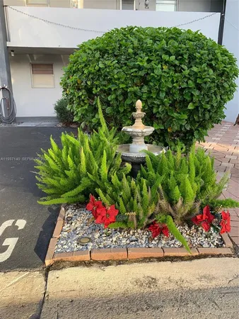 a bunch of flowers in front of the house
