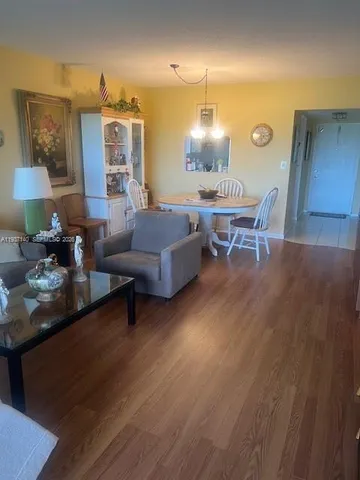 a room with furniture and wooden floor