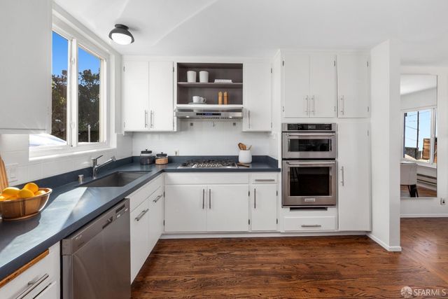 a front view of a house with large windows