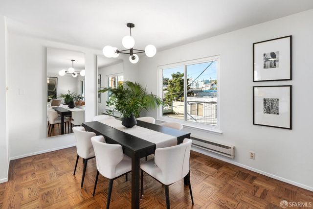 a living room with furniture fireplace and window