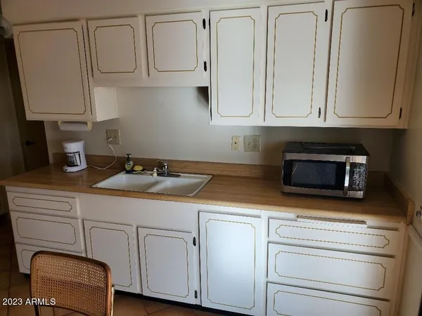 a kitchen with a stove and a microwave