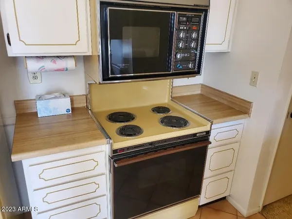 a bathroom with a sink a toilet and shower curtain