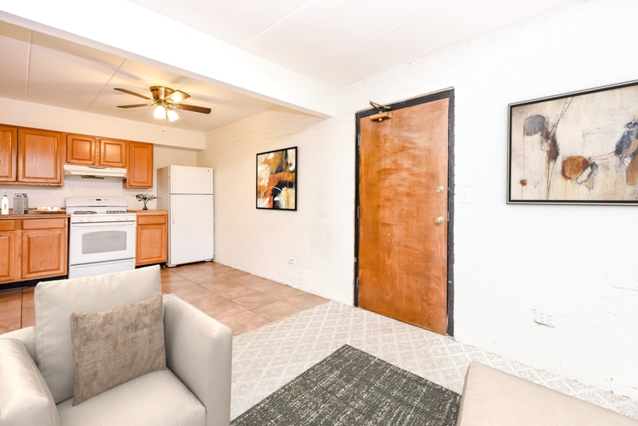 218 East Bailey Road, Unit A Naperville, IL 60565 - Photo 2 of 11 a living room with stainless steel appliances kitchen island granite countertop furniture and a view of kitchen