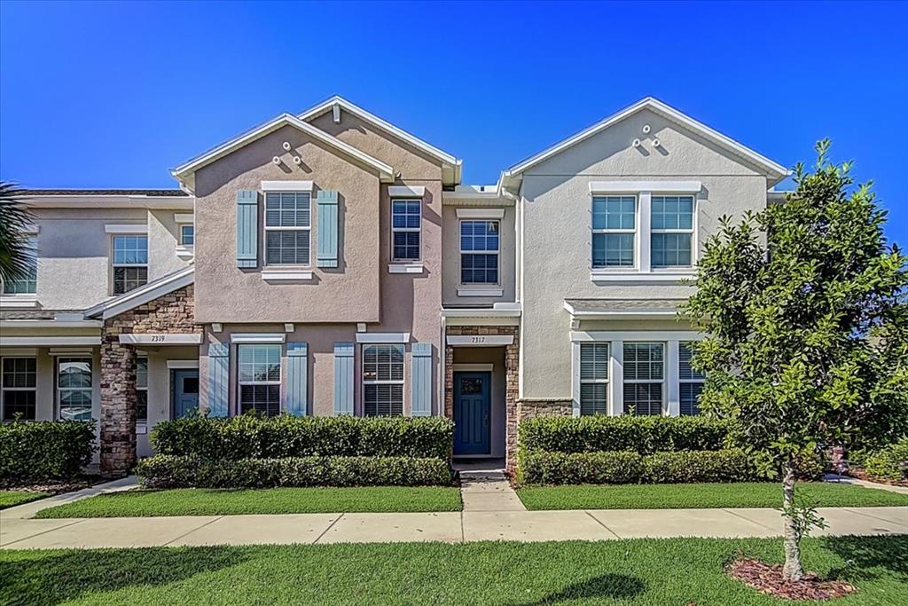 a front view of a house with a yard