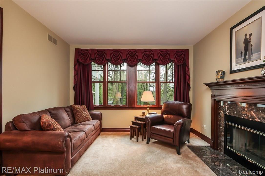 6945 Gawley Road Pinckney, MI 48169 - Photo 24 of 76 Cozy familyroom with natural fireplace to enjoy on cold winter nights