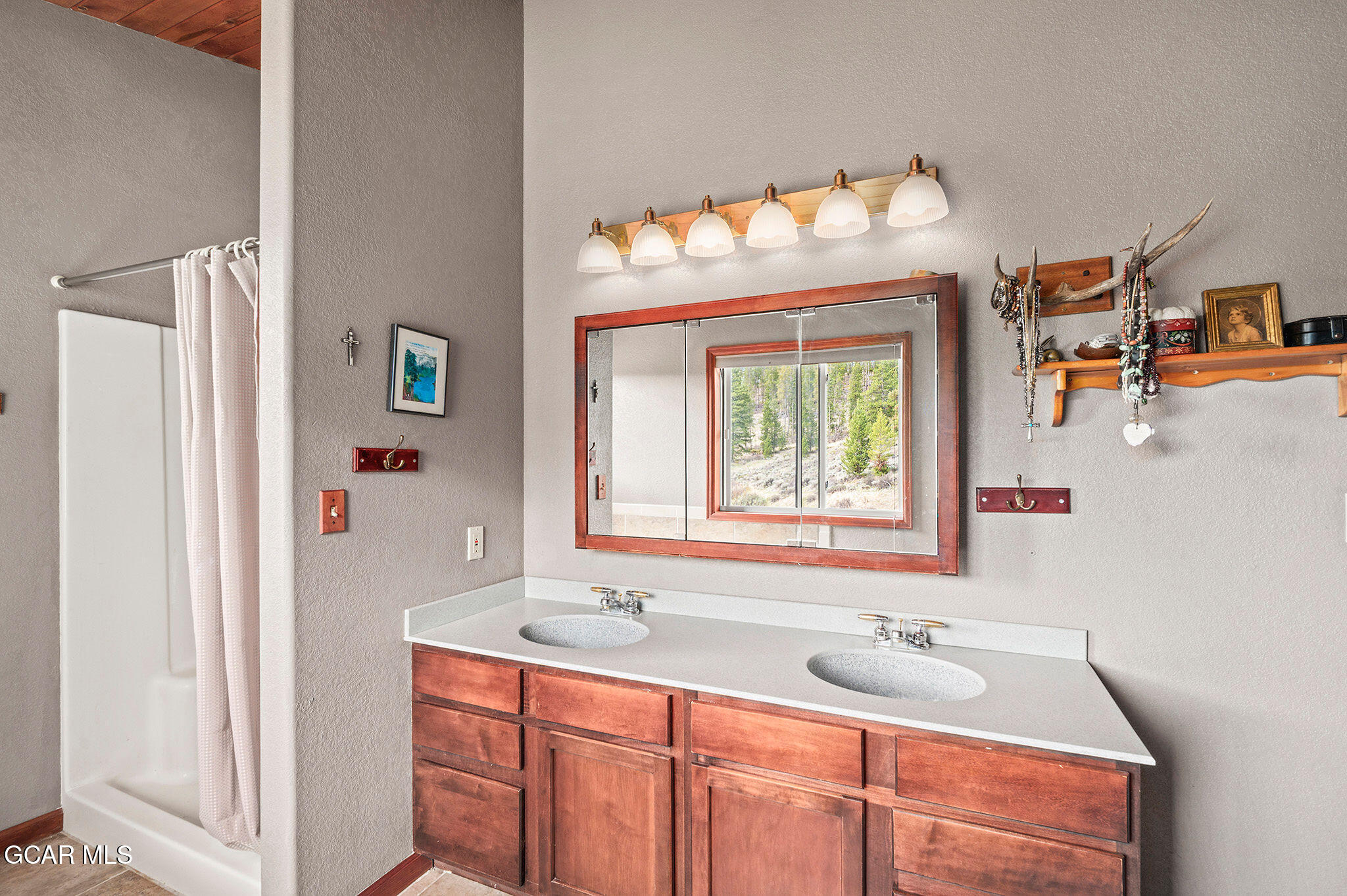 732 Gcr 8311/ Clayton Ranch Road Tabernash, CO 80478 - Photo 40 of 65 a bathroom with a sink and a mirror