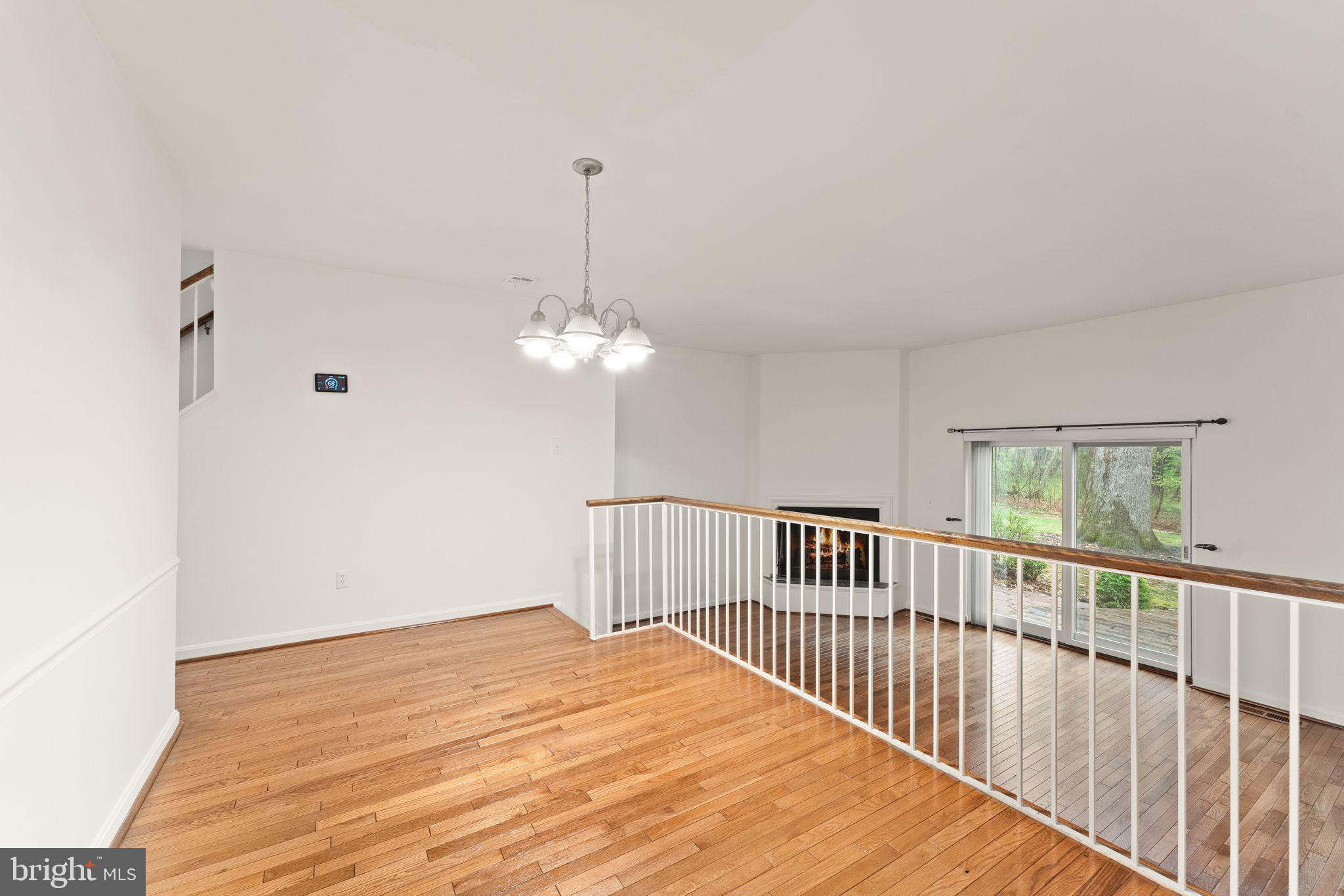 2212 Golf Course Drive Reston, VA 20191 - Photo 12 of 49 a view of a livingroom with wooden floor