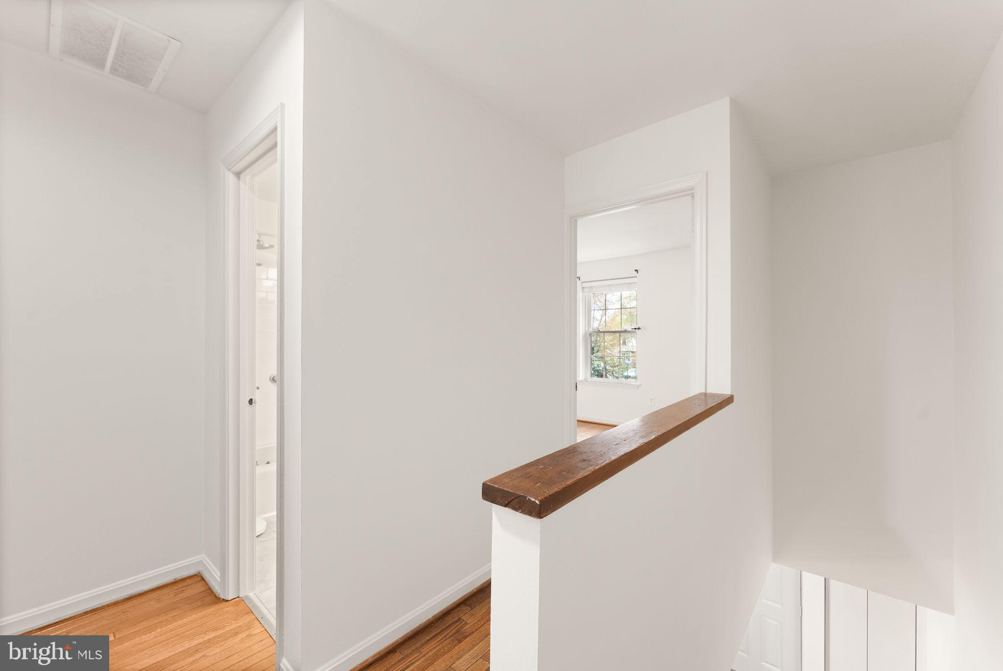 2212 Golf Course Drive Reston, VA 20191 - Photo 19 of 49 a view of an entryway with wooden floor