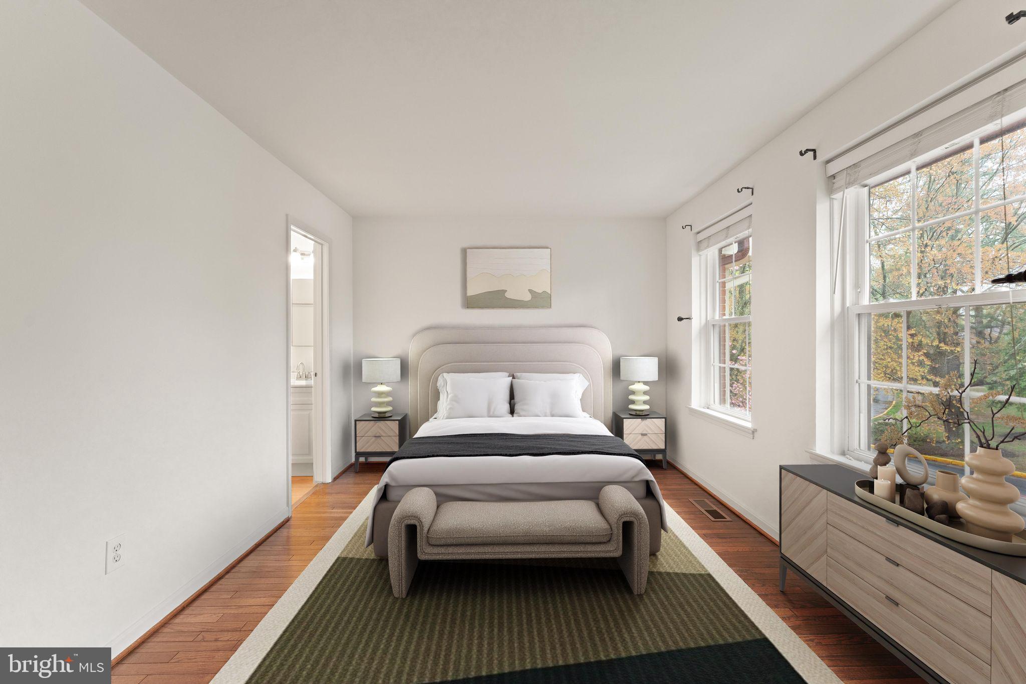 2212 Golf Course Drive Reston, VA 20191 - Photo 20 of 49 a bedroom with a bed lamp and a large window with wooden floor