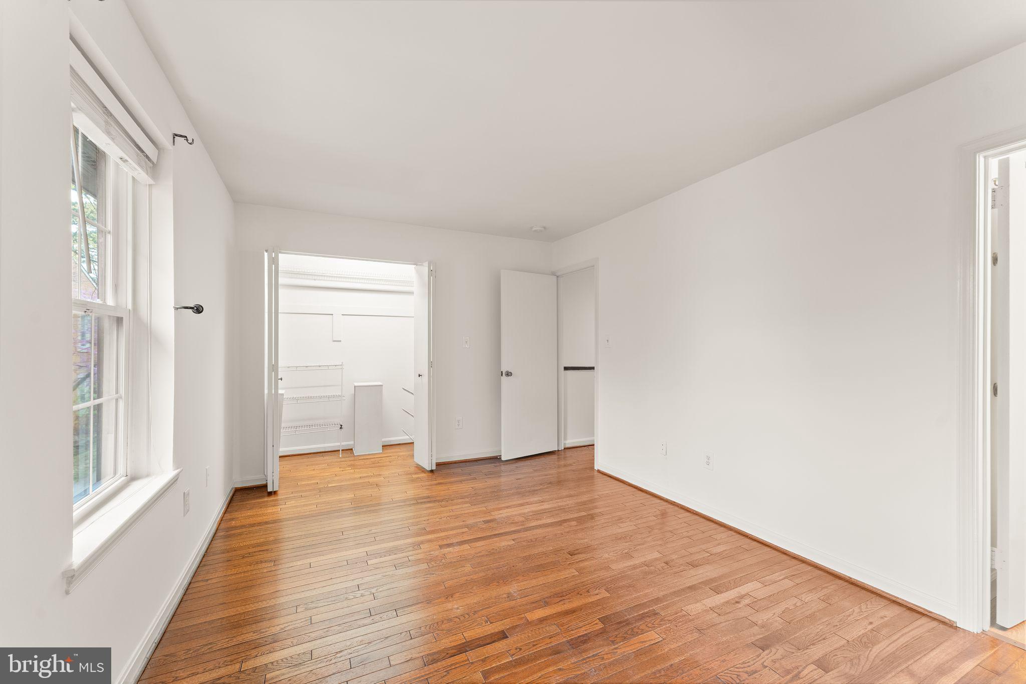 2212 Golf Course Drive Reston, VA 20191 - Photo 22 of 49 a view of a livingroom with wooden floor