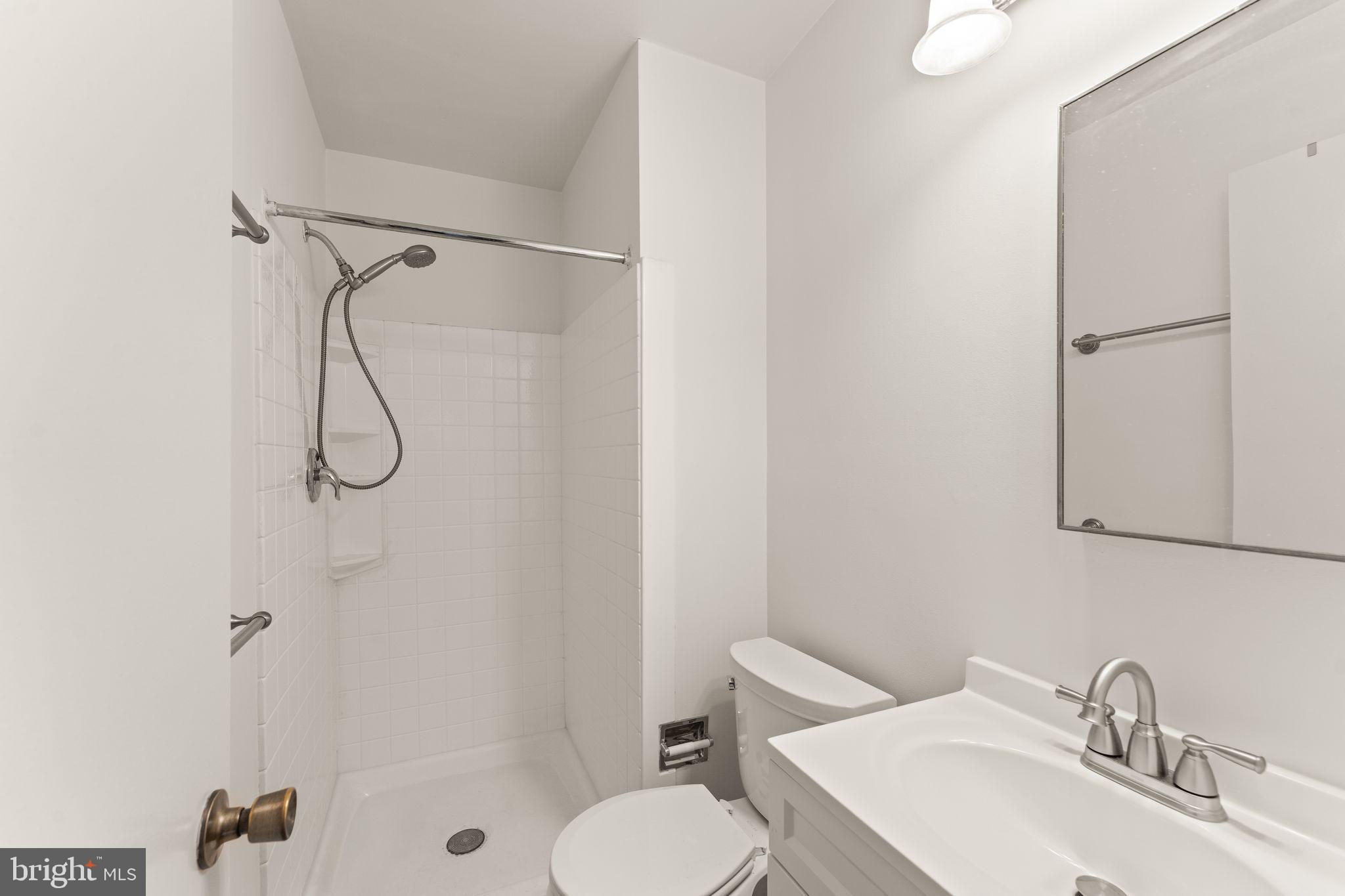 2212 Golf Course Drive Reston, VA 20191 - Photo 24 of 49 a bathroom with a sink toilet and shower