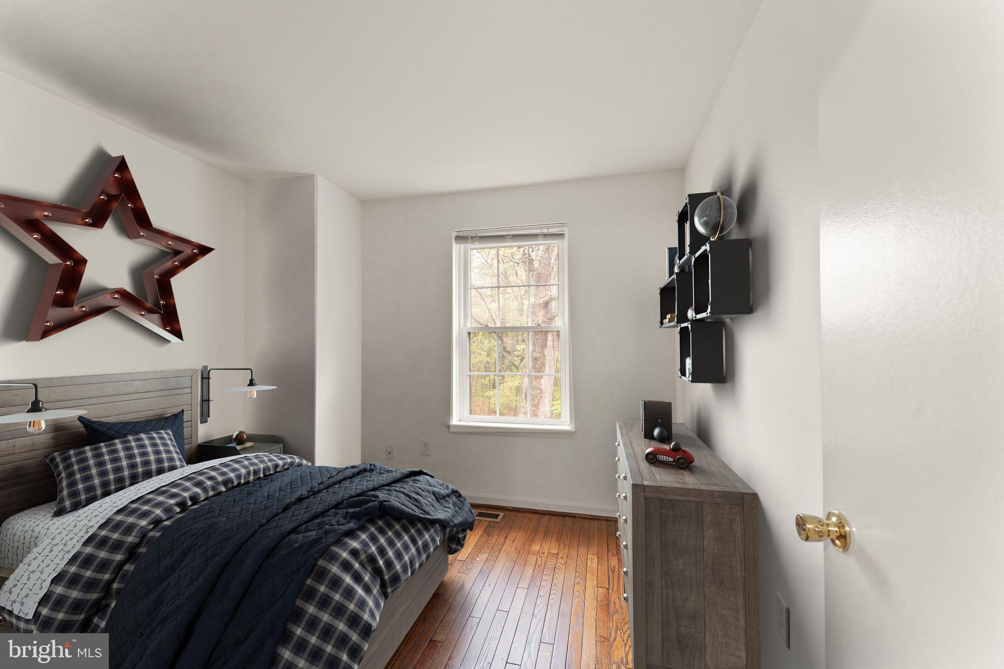 2212 Golf Course Drive Reston, VA 20191 - Photo 25 of 49 a bedroom with a bed and a window