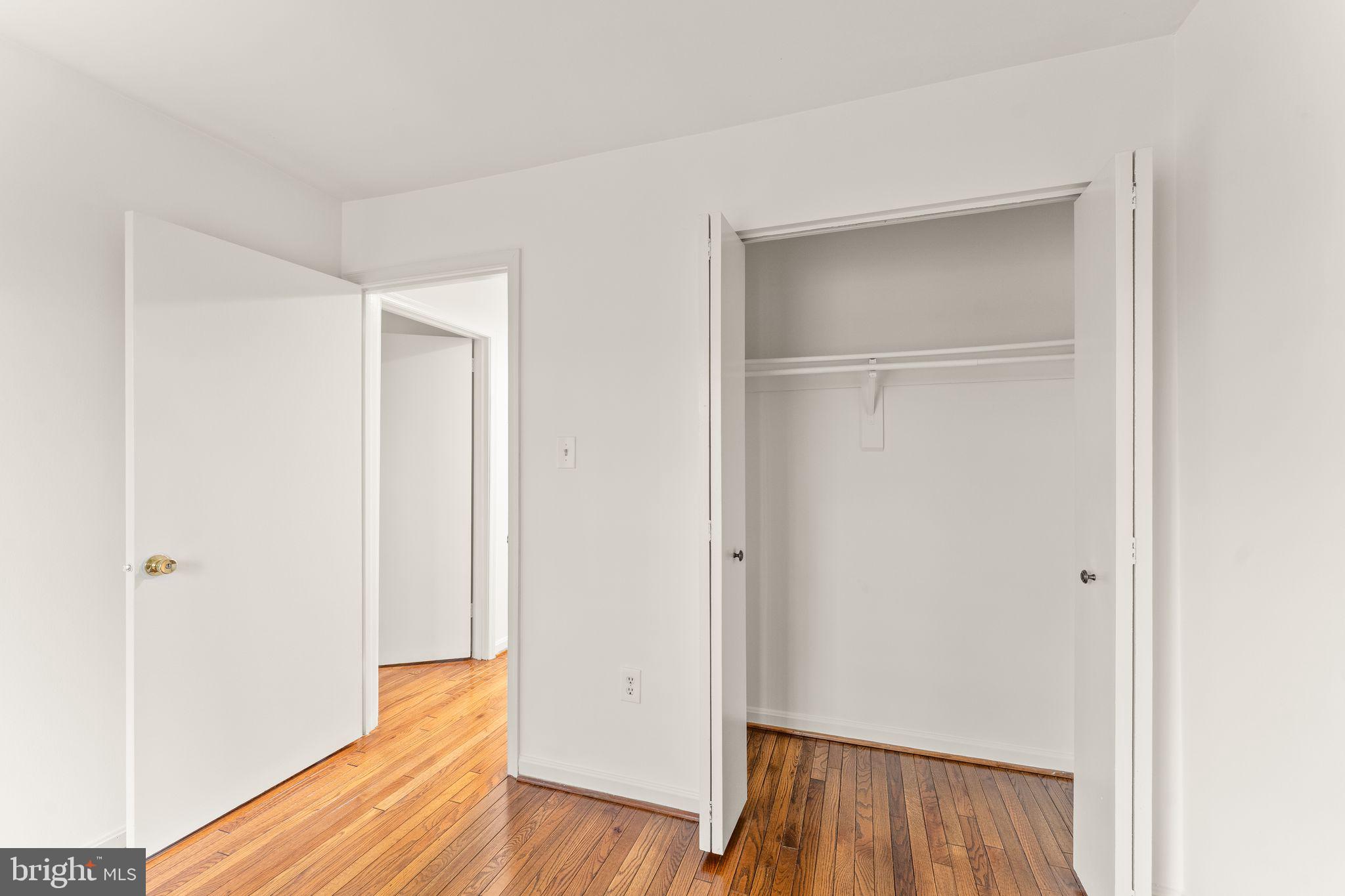 2212 Golf Course Drive Reston, VA 20191 - Photo 27 of 49 a view of empty room with wooden floor