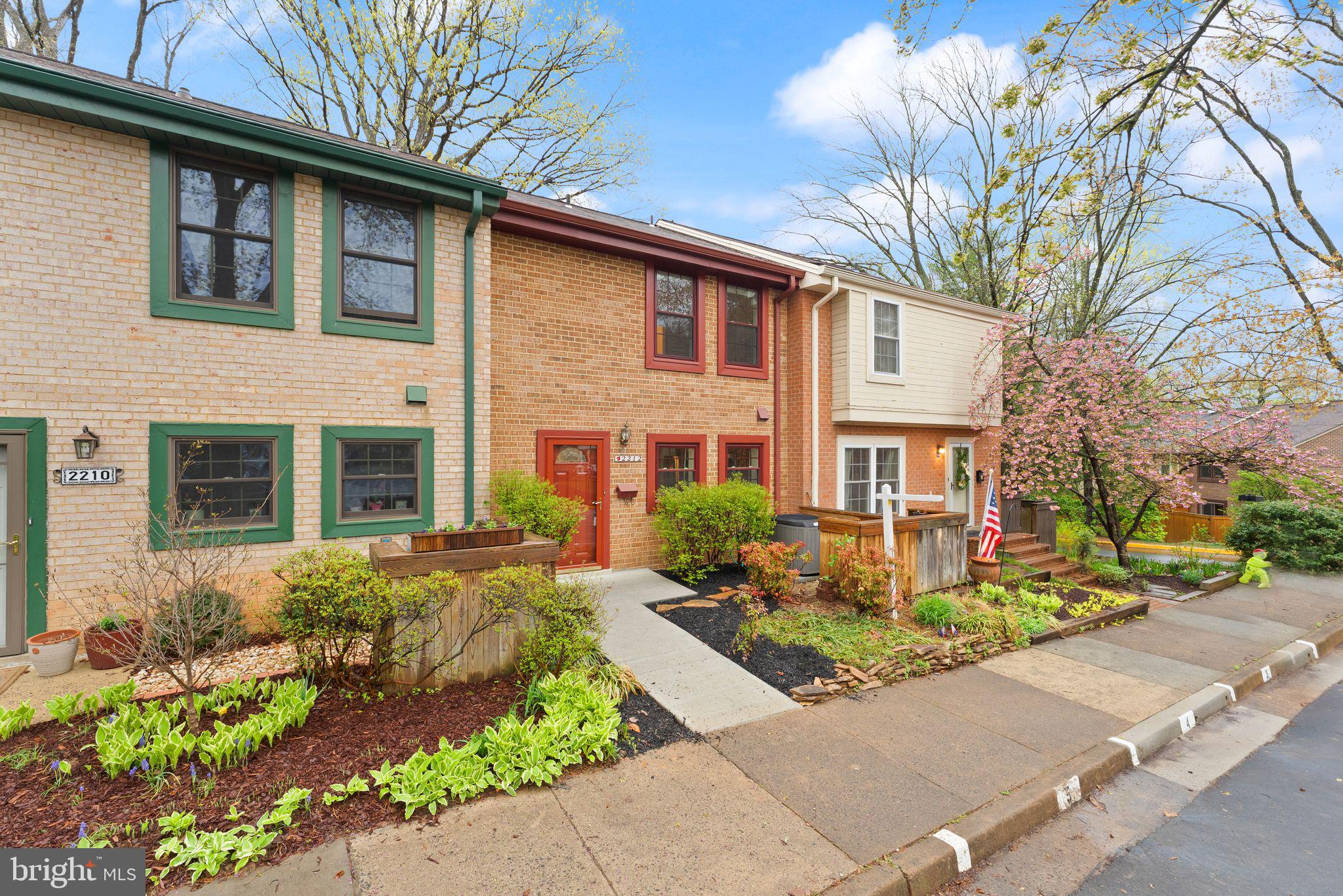 2212 Golf Course Drive Reston, VA 20191 - Photo 3 of 49 a front view of a house with a yard