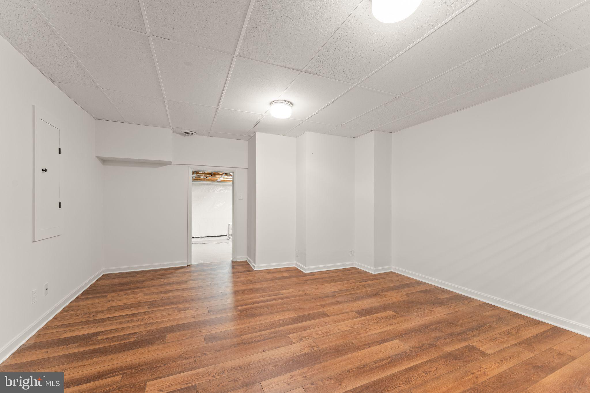2212 Golf Course Drive Reston, VA 20191 - Photo 35 of 49 a view of empty room with wooden floor