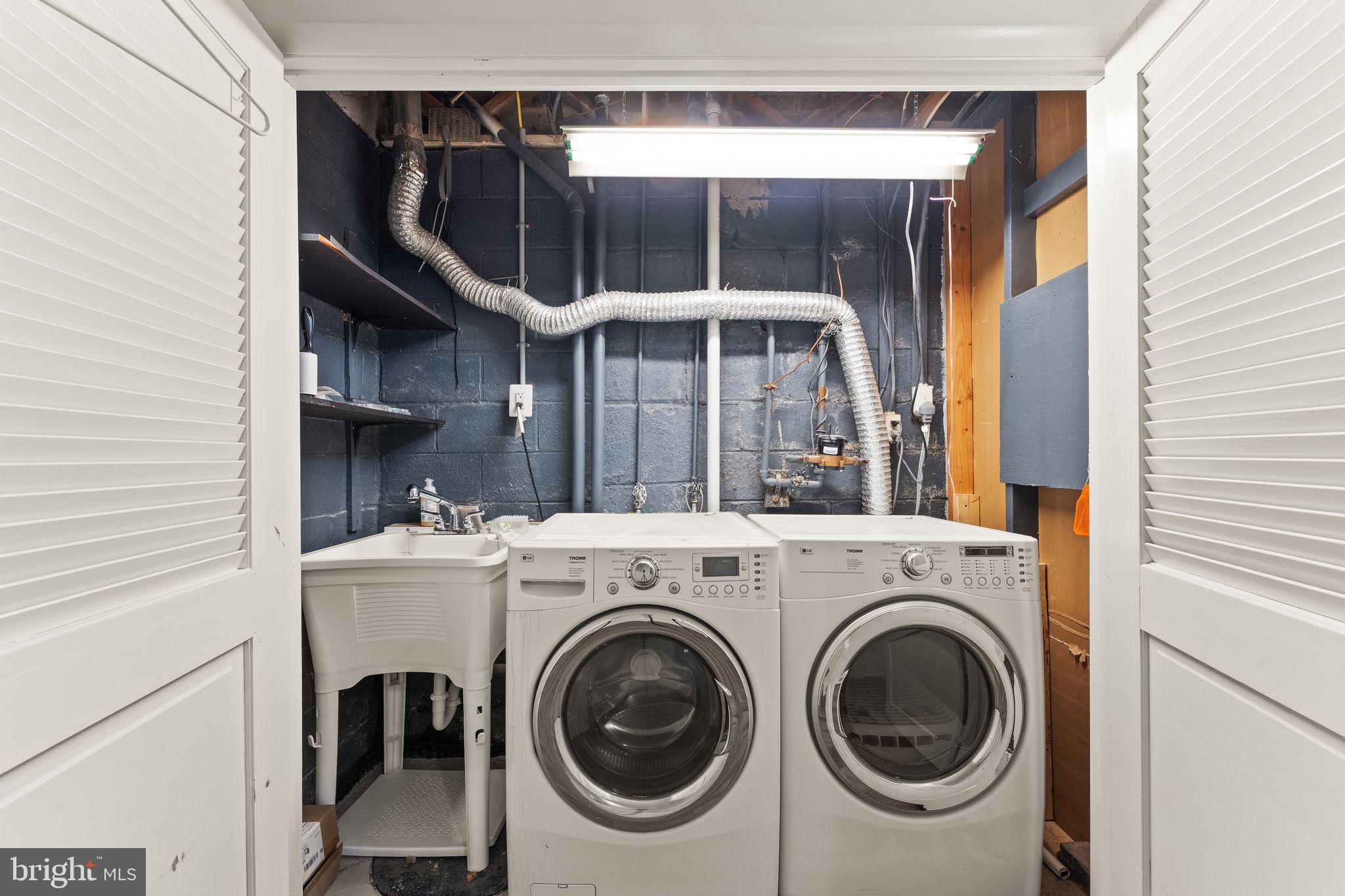 2212 Golf Course Drive Reston, VA 20191 - Photo 37 of 49 a utility room with dryer and washer