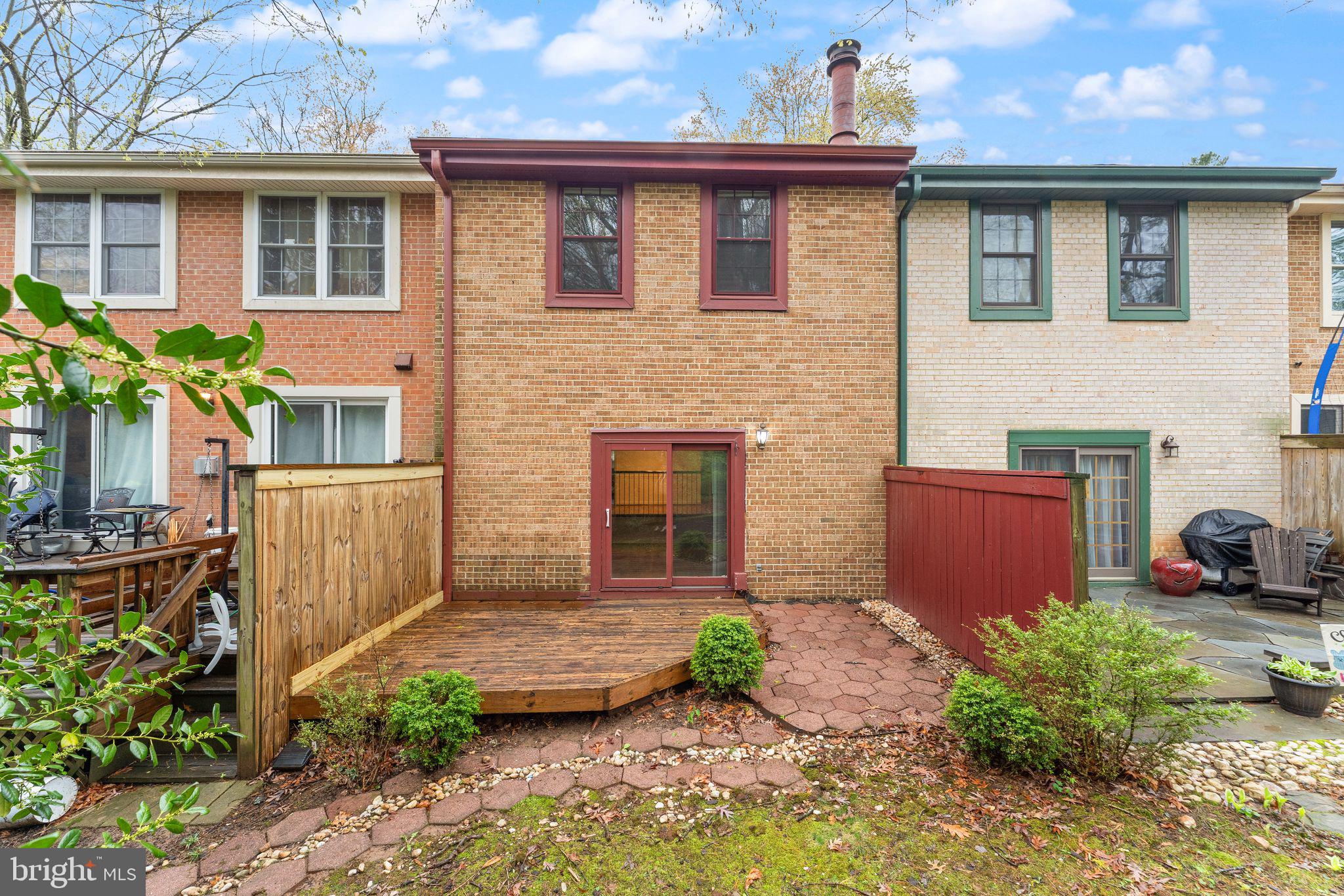 2212 Golf Course Drive Reston, VA 20191 - Photo 41 of 49 a front view of a house with garden