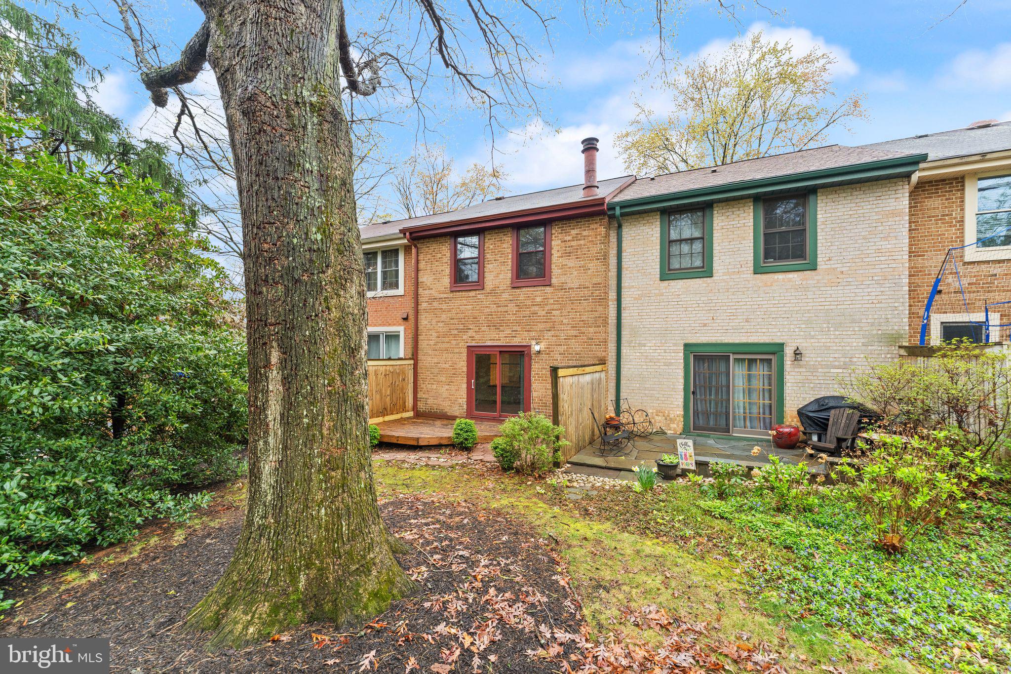 2212 Golf Course Drive Reston, VA 20191 - Photo 42 of 49 a front view of a house with garden