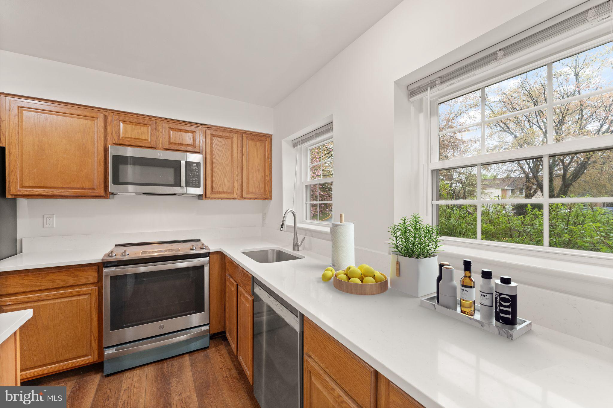 2212 Golf Course Drive Reston, VA 20191 - Photo 6 of 49 a kitchen with a sink a stove and cabinets