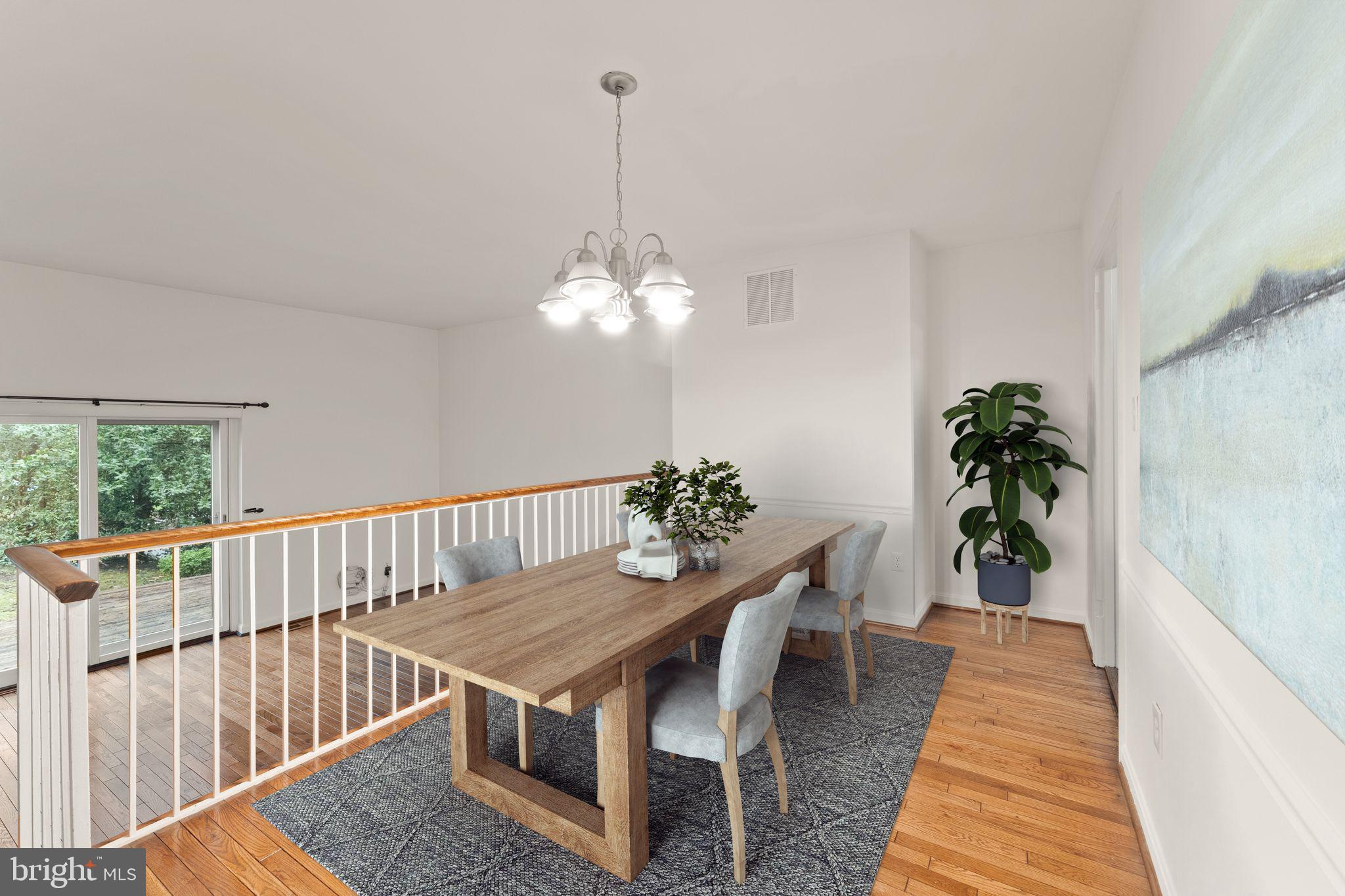 2212 Golf Course Drive Reston, VA 20191 - Photo 10 of 49 a dining room with furniture potted plants and wooden floor