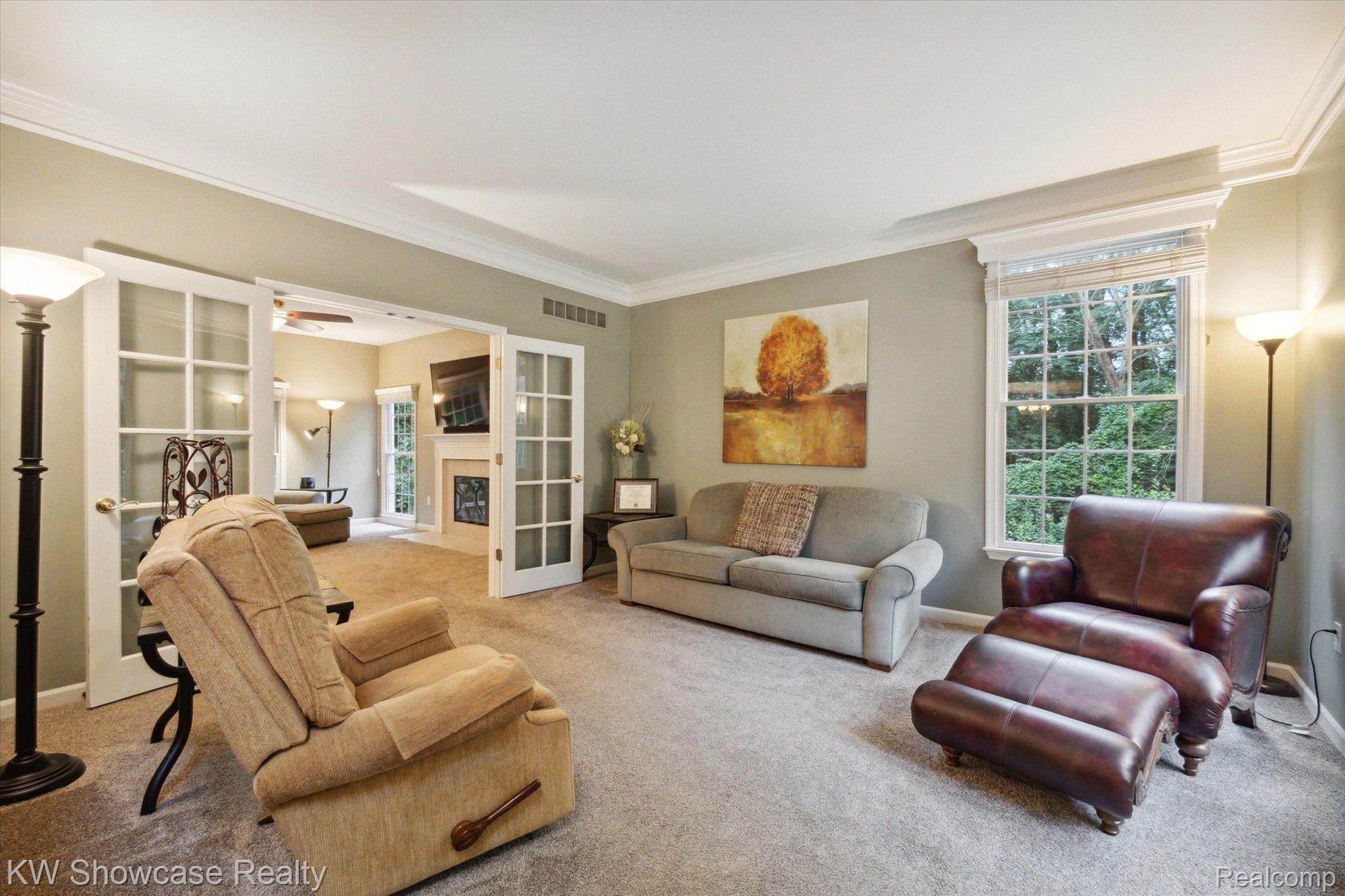 564 Timber Ridge Drive Highland, MI 48357 - Photo 6 of 40 The Living Room flows into the Family Room.