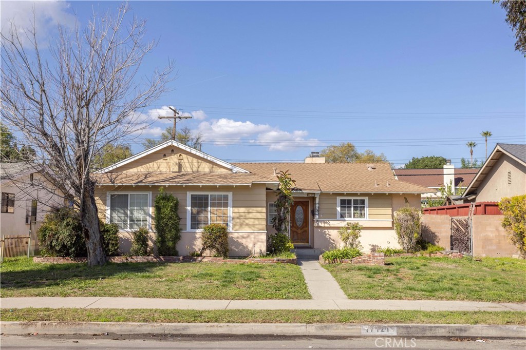 17121 Rinaldi Street Granada Hills, CA 91344 - Photo 1 of 1 a front view of a house with garden