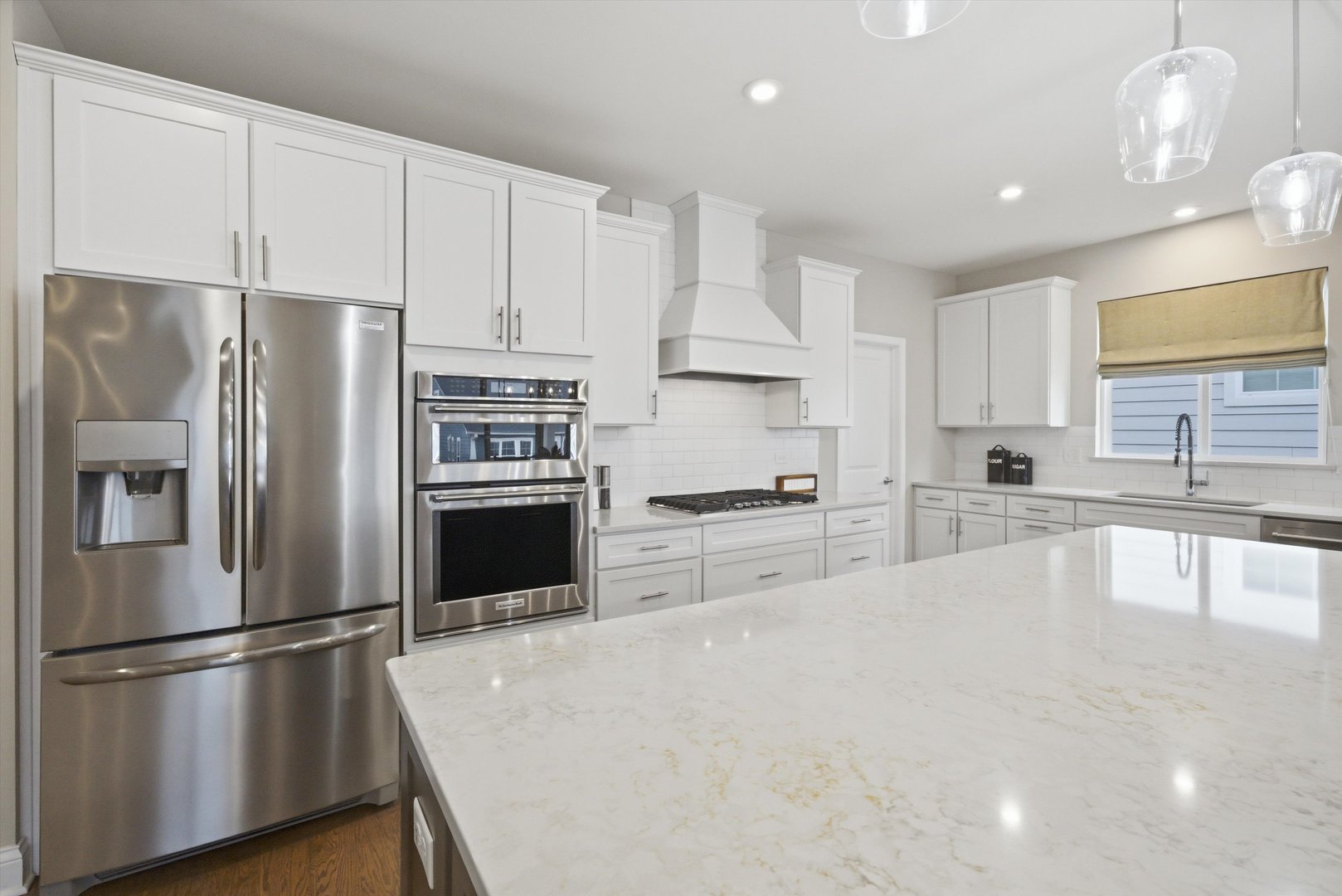76 Somerset Circle Wheaton, IL 60189 - Photo 11 of 40 a kitchen with granite countertop a refrigerator and a sink