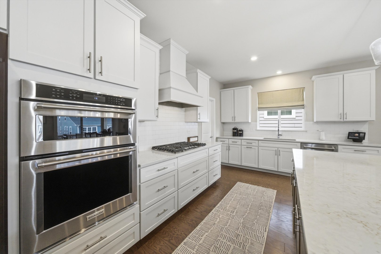76 Somerset Circle Wheaton, IL 60189 - Photo 12 of 40 a kitchen with granite countertop white cabinets and stainless steel appliances