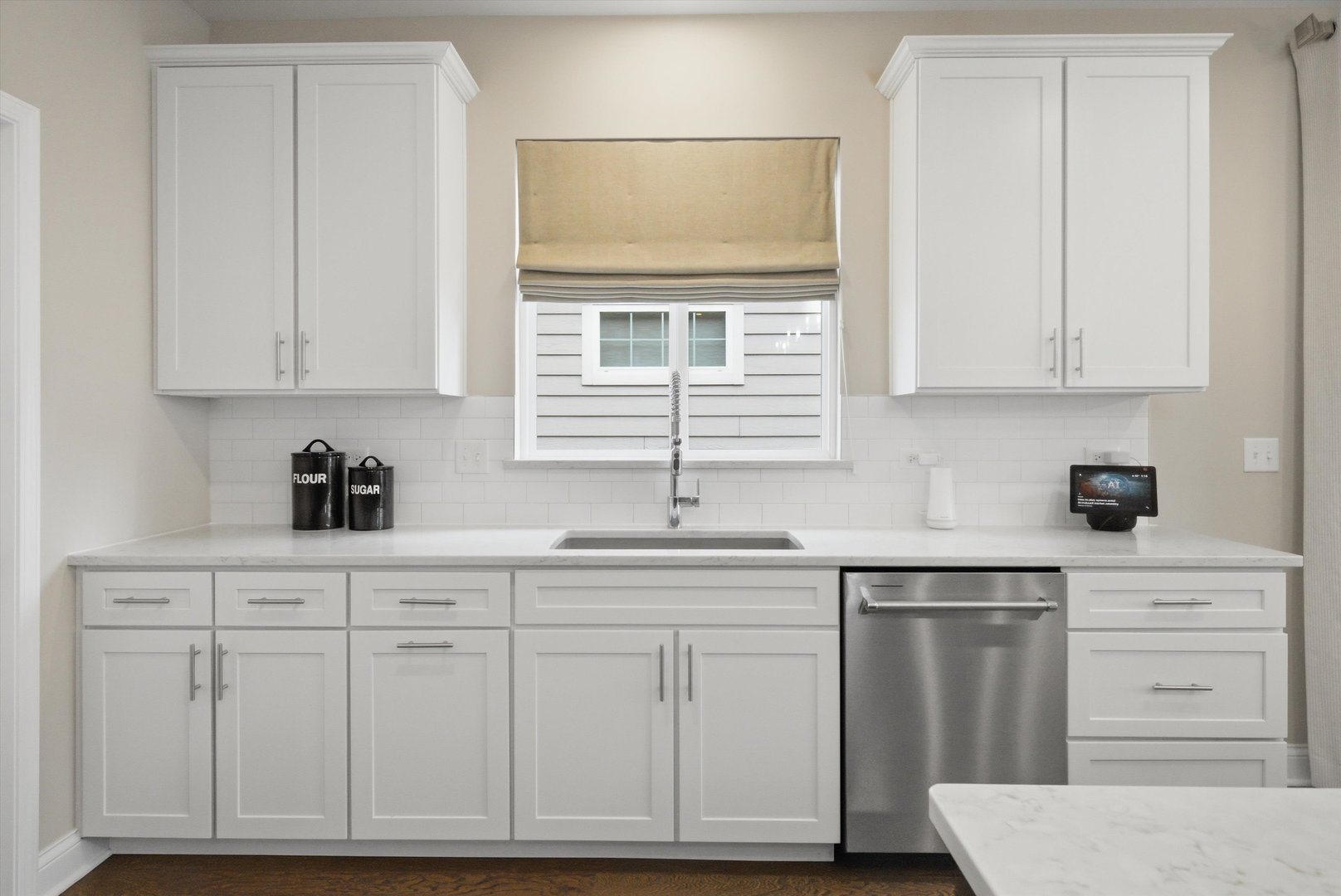 76 Somerset Circle Wheaton, IL 60189 - Photo 13 of 40 a kitchen with white cabinets and sink