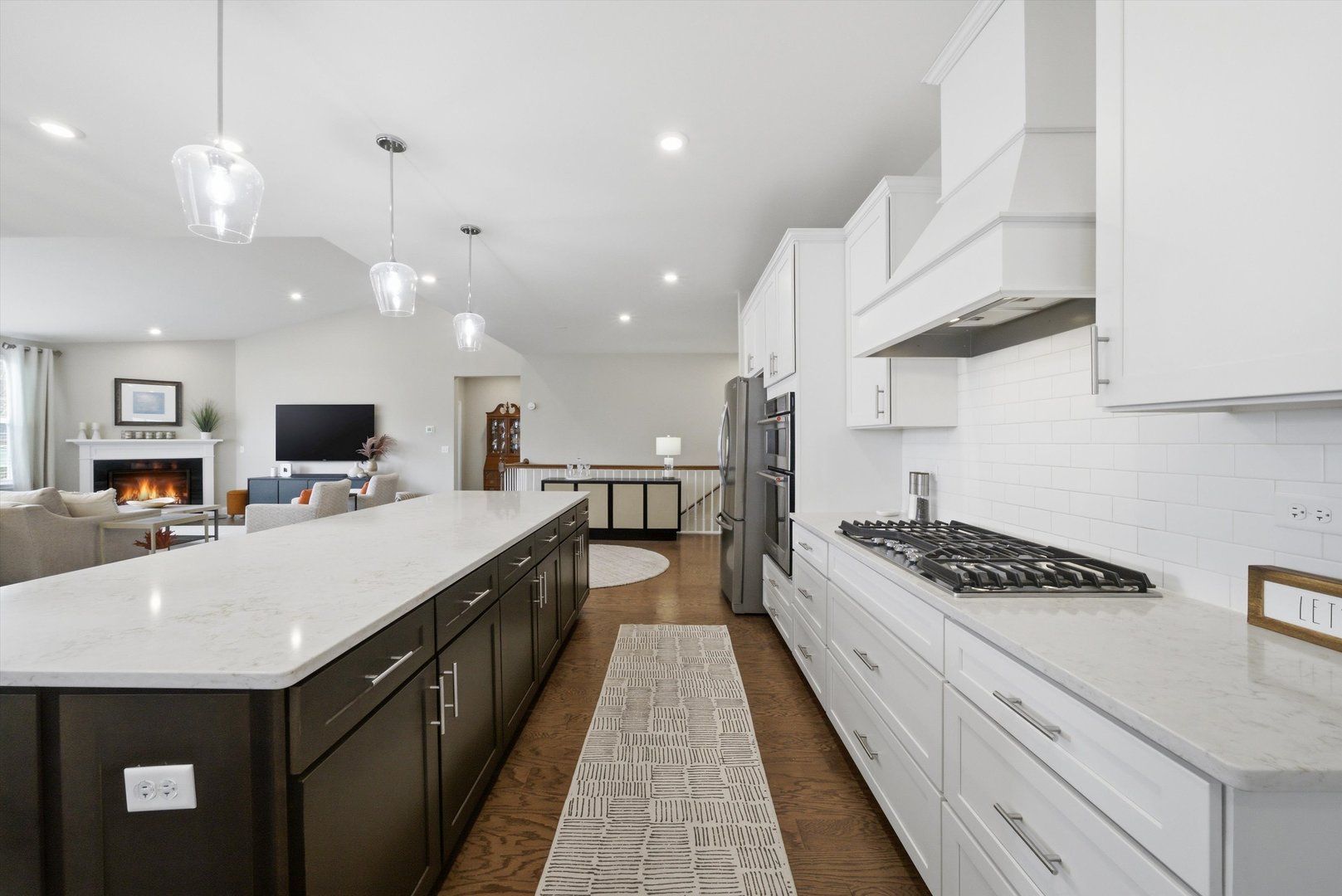 76 Somerset Circle Wheaton, IL 60189 - Photo 14 of 40 a large kitchen with stainless steel appliances kitchen island a large counter top and stove