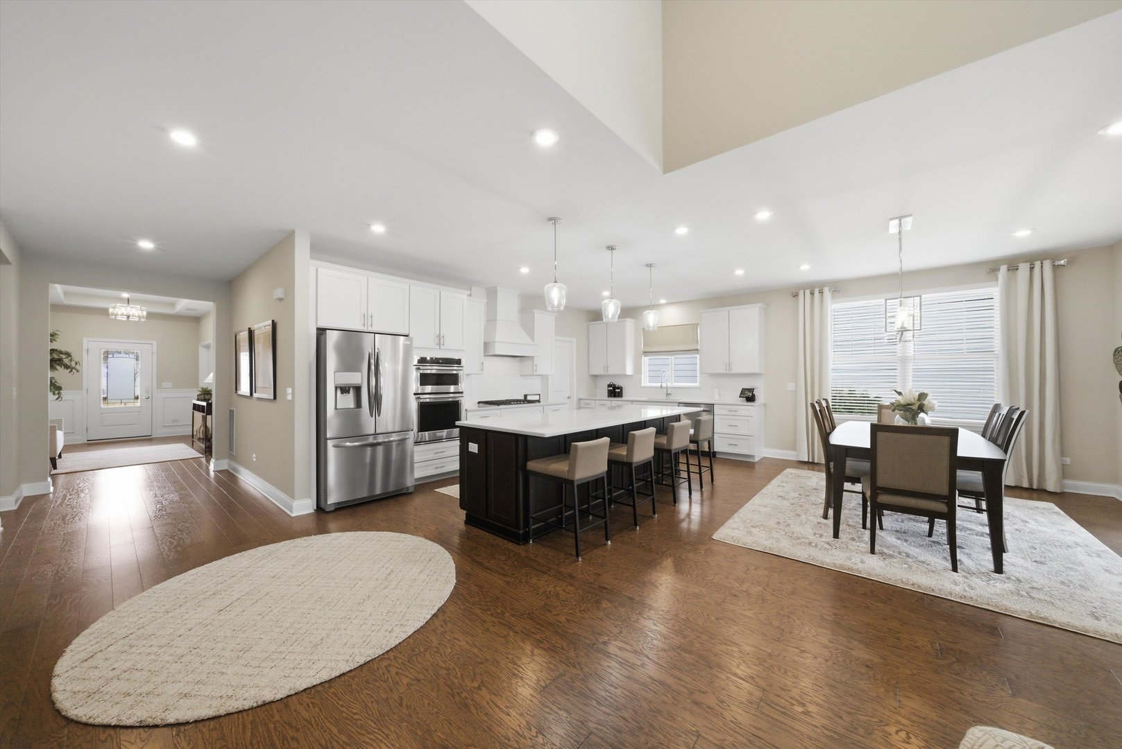 76 Somerset Circle Wheaton, IL 60189 - Photo 21 of 40 a view of kitchen with kitchen island a refrigerator sink dining table and chairs