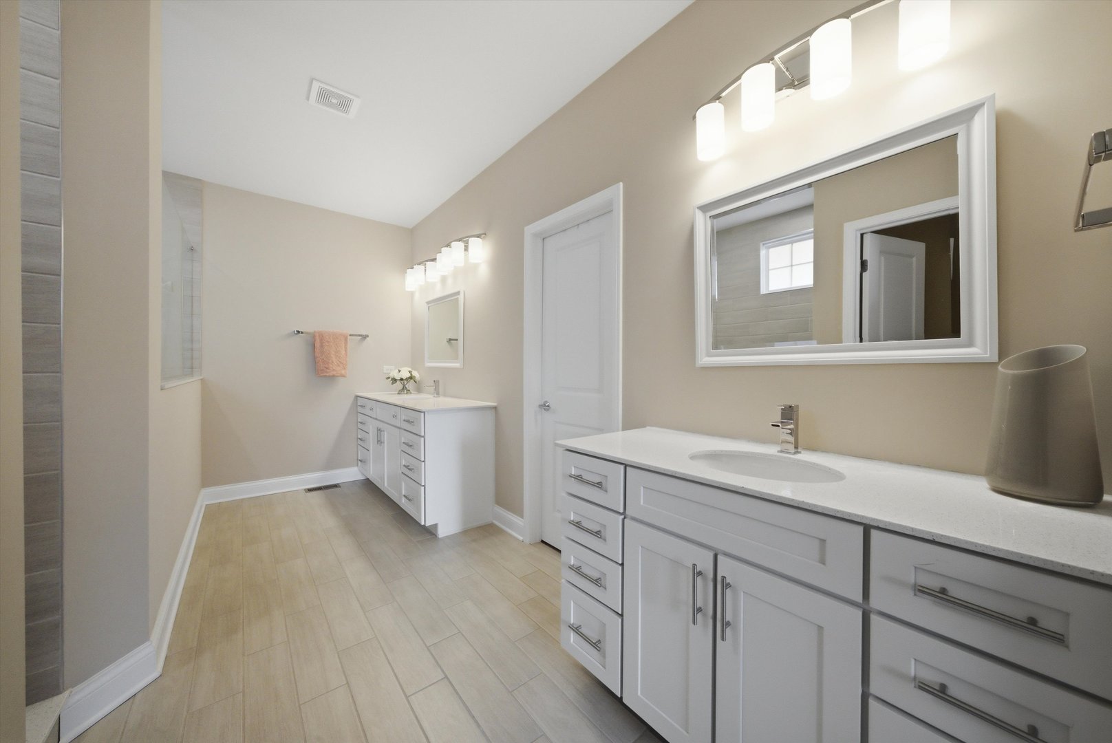 76 Somerset Circle Wheaton, IL 60189 - Photo 23 of 40 a bathroom with a toilet sink and mirror