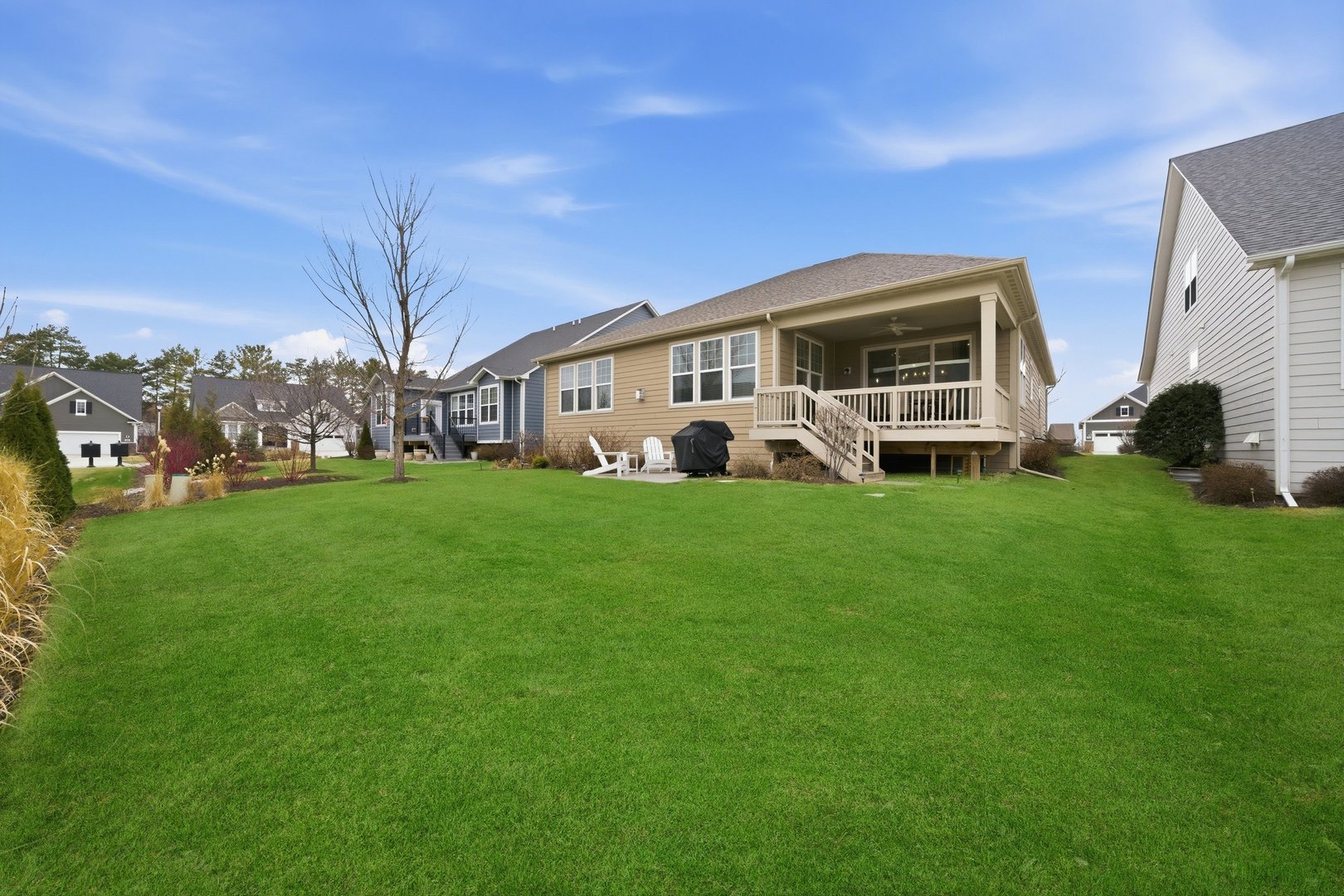 76 Somerset Circle Wheaton, IL 60189 - Photo 34 of 40 a view of a house with a big yard and large trees