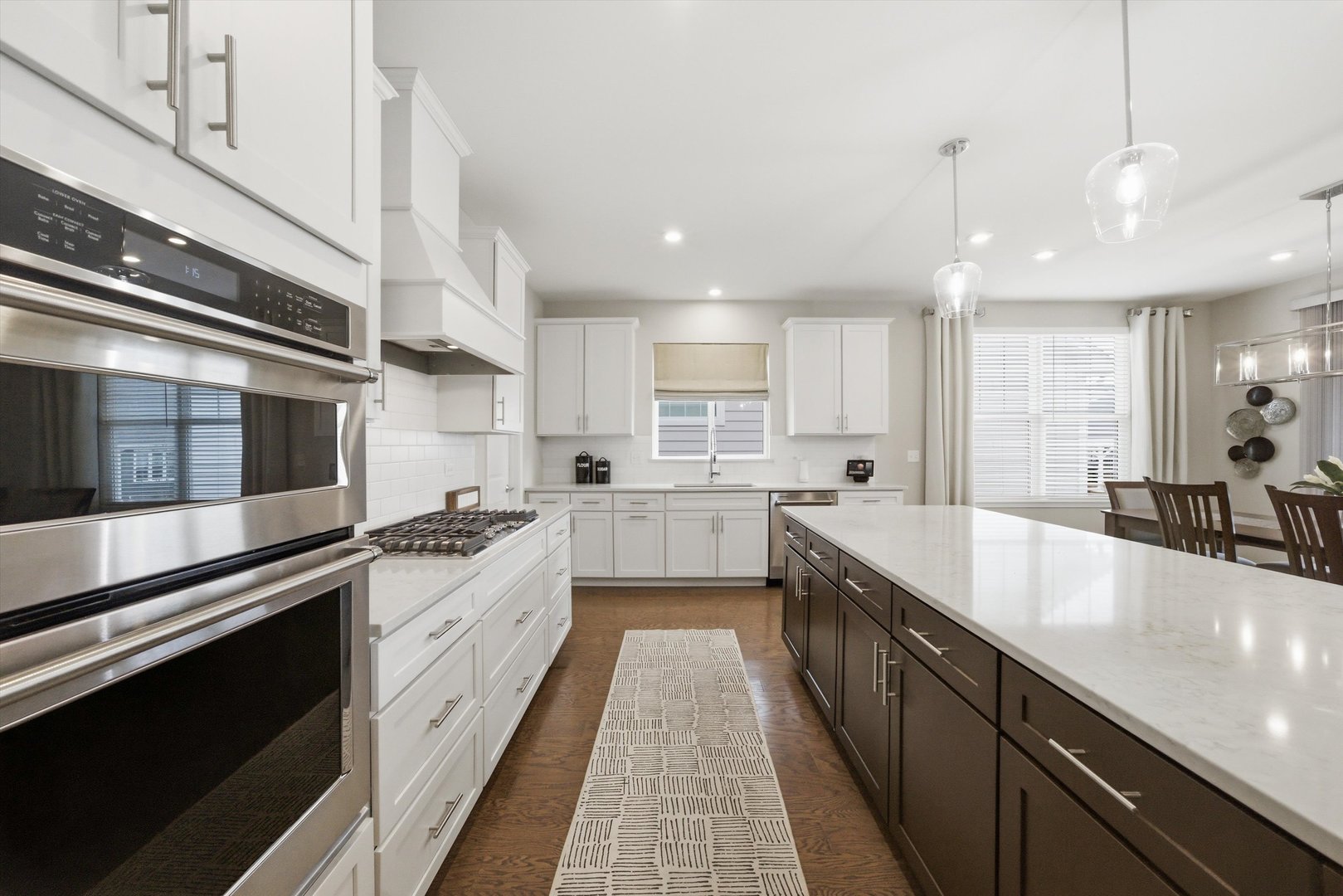 76 Somerset Circle Wheaton, IL 60189 - Photo 7 of 40 a large kitchen with stainless steel appliances lots of counter space and a sink