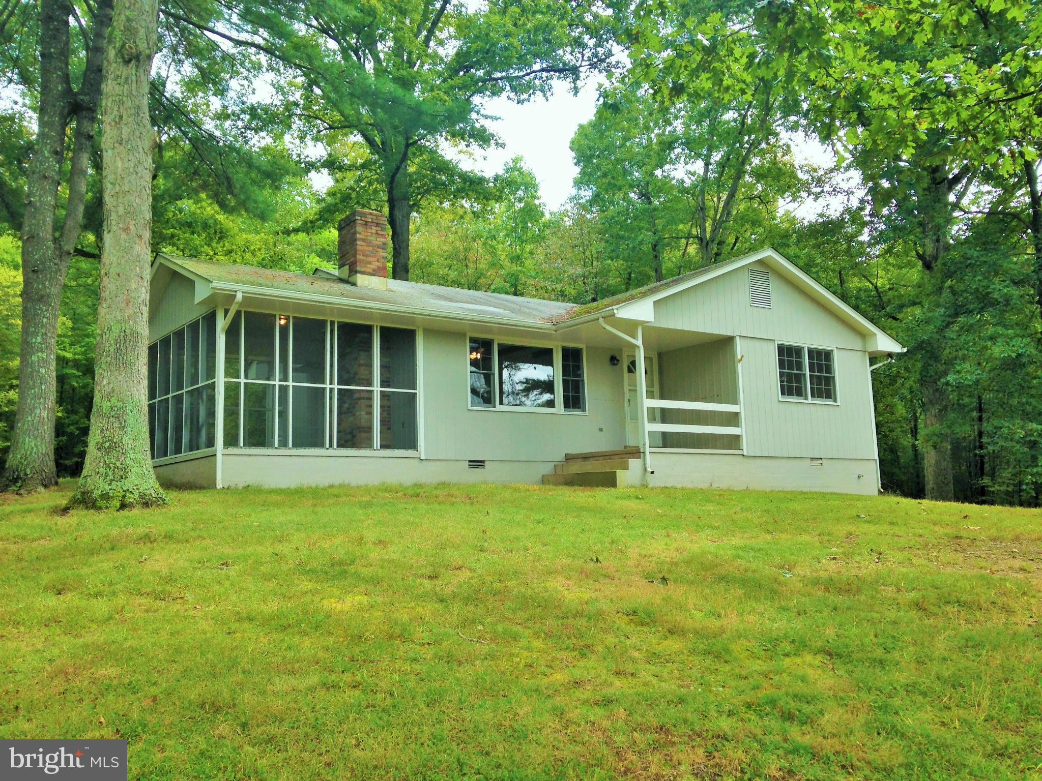 353 Aaron Mountain Road Castleton, VA 22716 - Photo 11 of 23 The cottage is perched on a hill overlooking pond